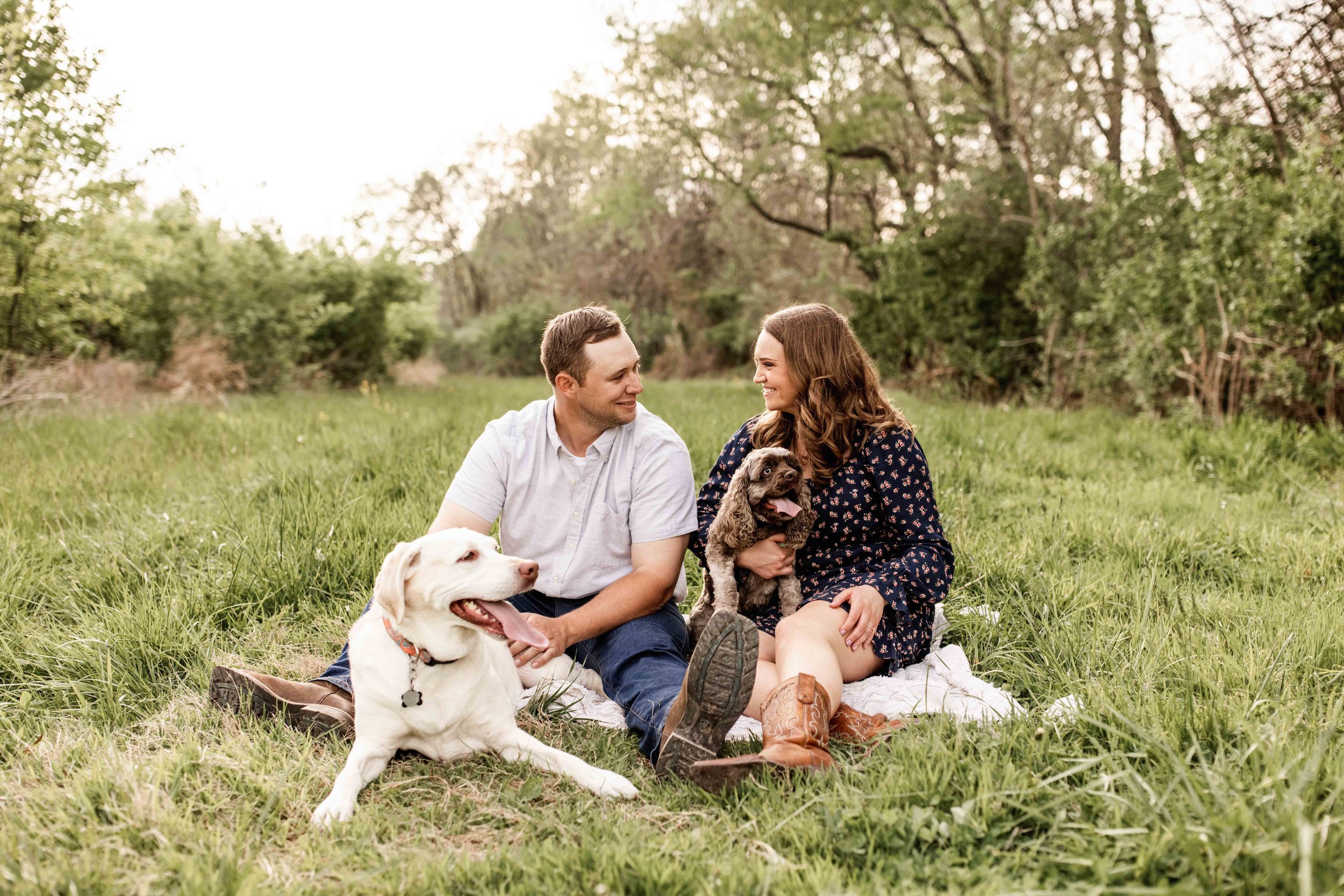 Engaged couple with dogs in Lee's Summit Missouri
