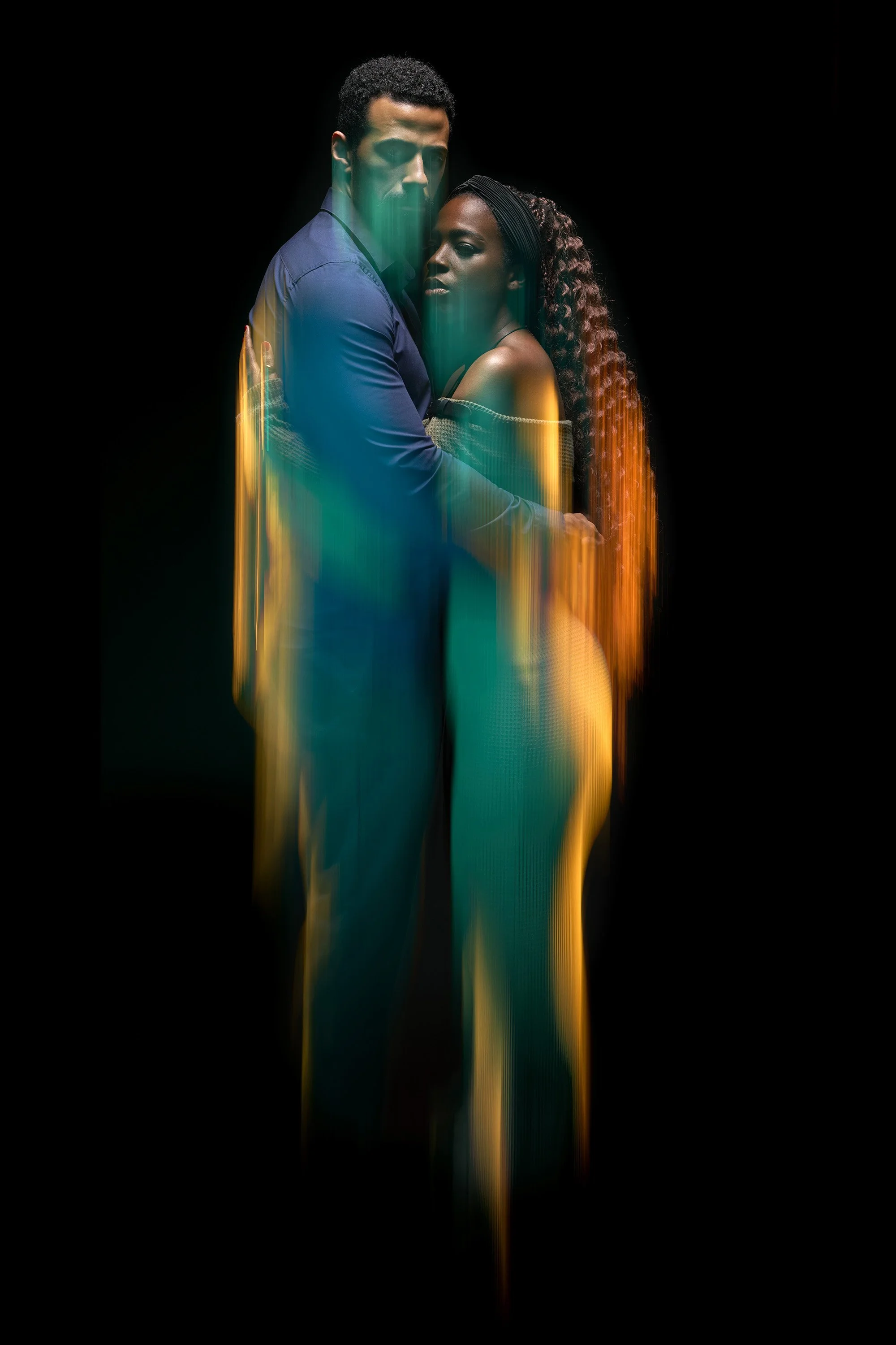 Poster for the short film Split Ends, the image shows a young couple (a Black woman and a Mixed Race man) embracing, while shutter drag on the highlights gives the impression that they or their relationship are dissolving or falling apart