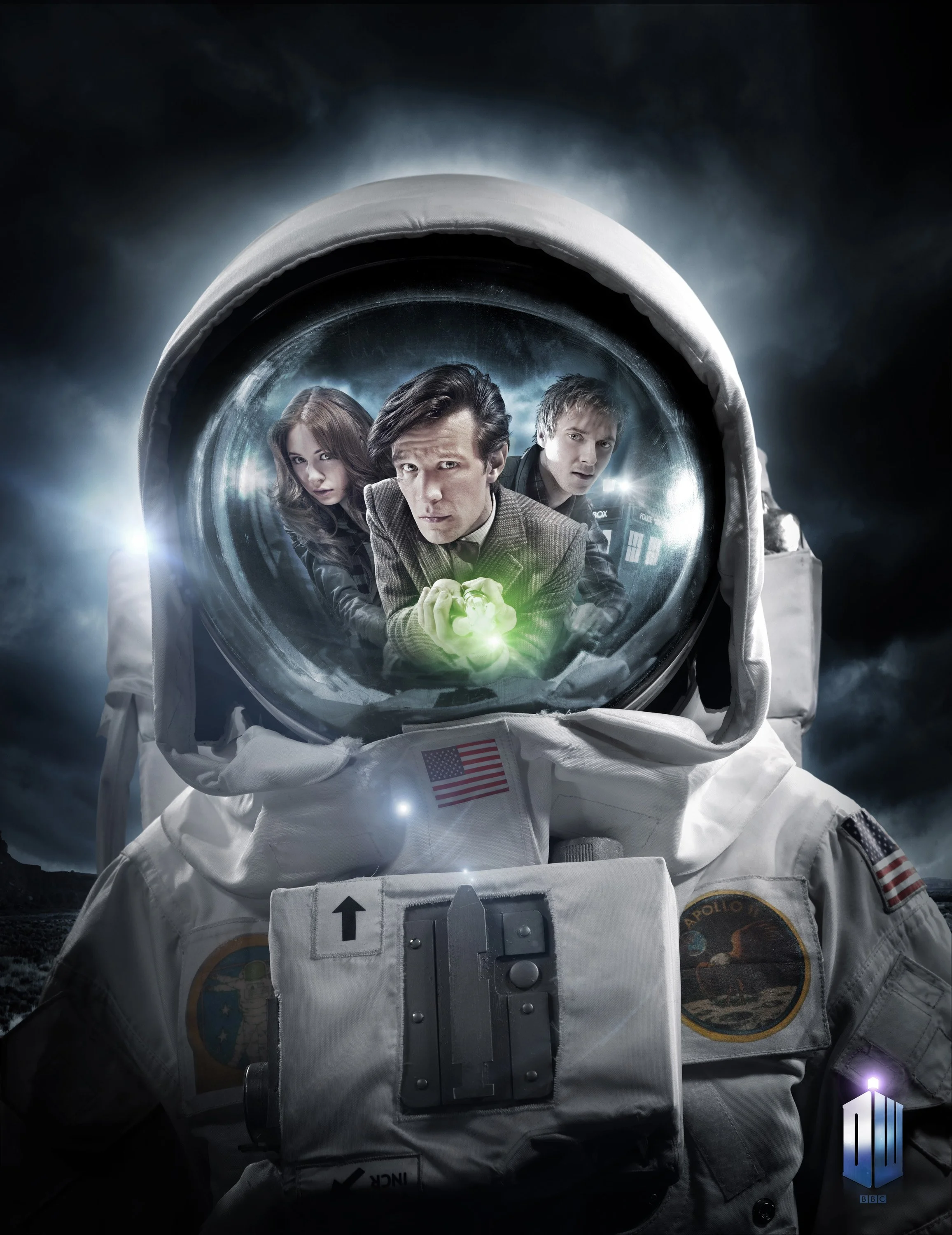 Publicity image for Doctor Who. Matt Smith, Karen Gillan and Arthur Darvill are seen refected in the visor of a NASA space suit. Matt Smith as the Doctor is holding the sonic screwdriver. entertainment portrait photography by Steve Bright, London