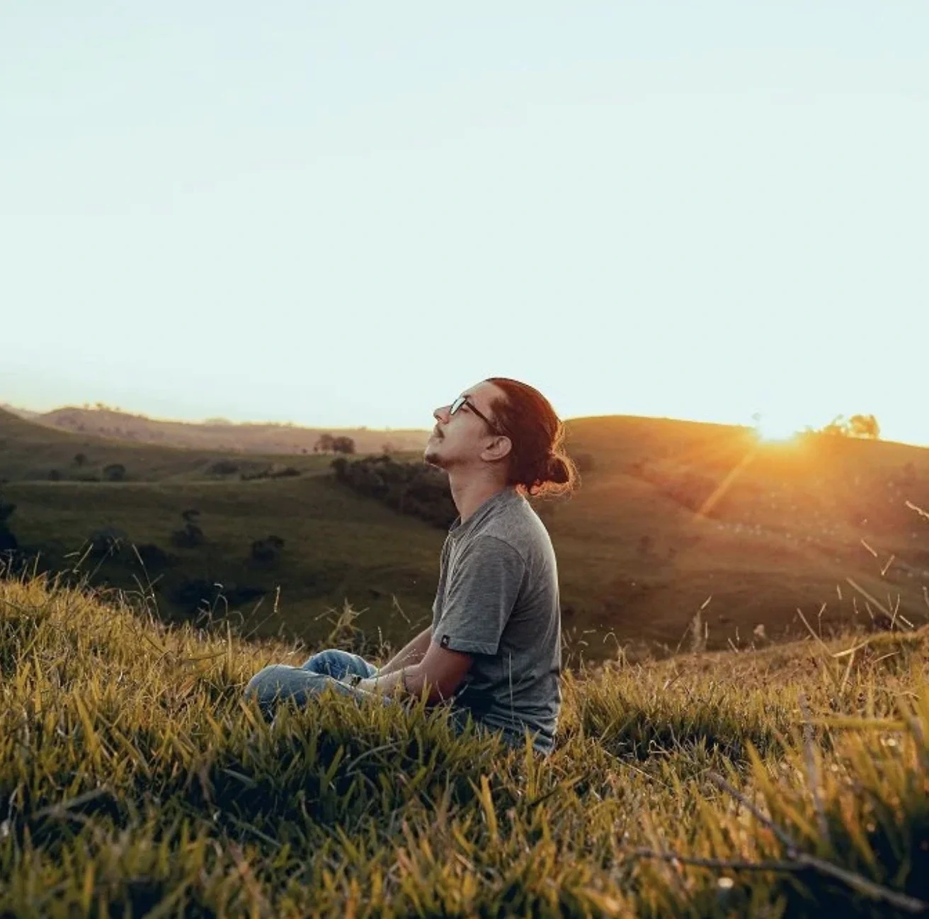 a man with adhd in an introspective state sitting outside