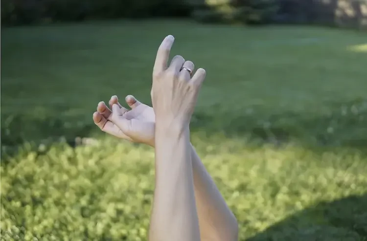 a peaceful picture of a person  lying in the grass