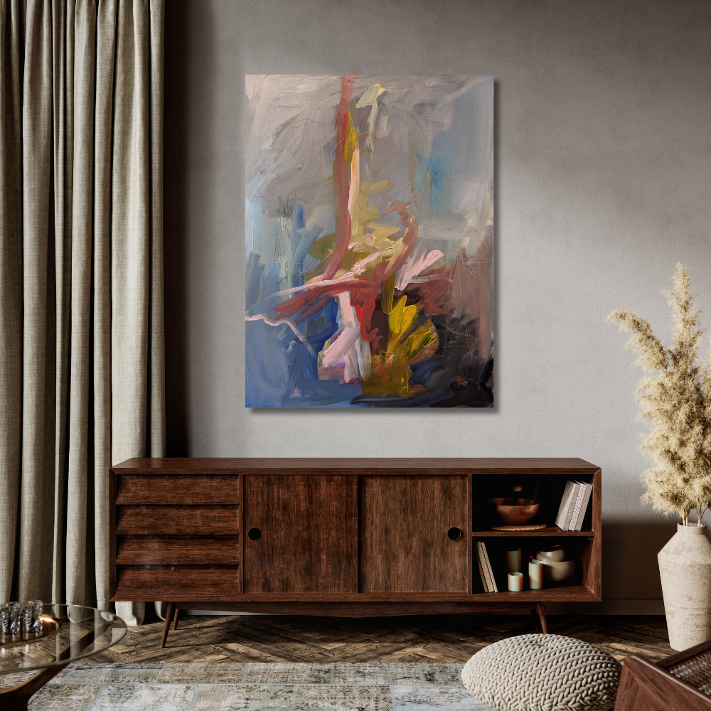 Modern living room with a wooden sideboard, abstract painting, two beige chairs, a black floor lamp, and a round coffee table with vases.