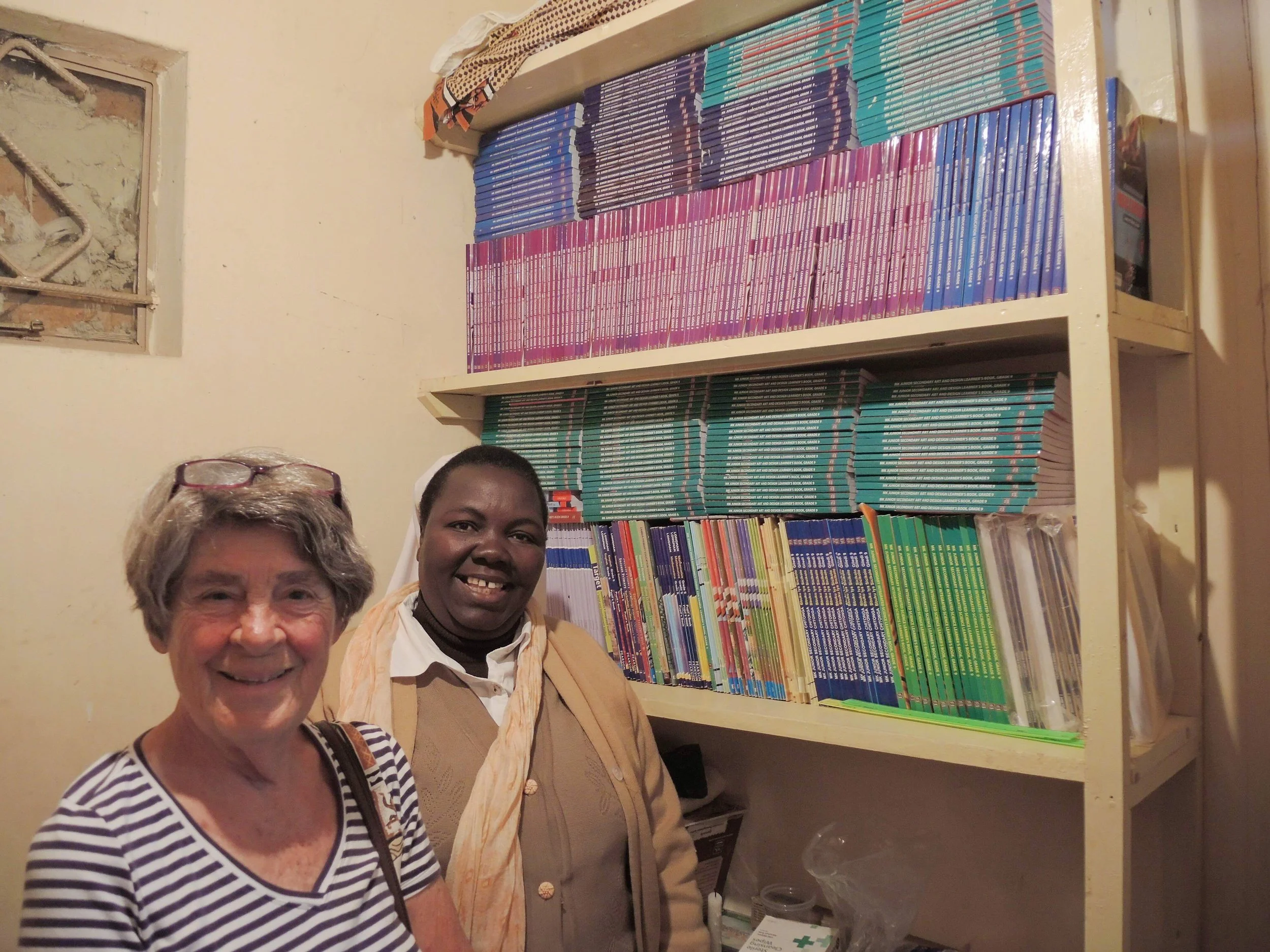 Sr Lontia and Marylee with donated textbooks resize.jpeg