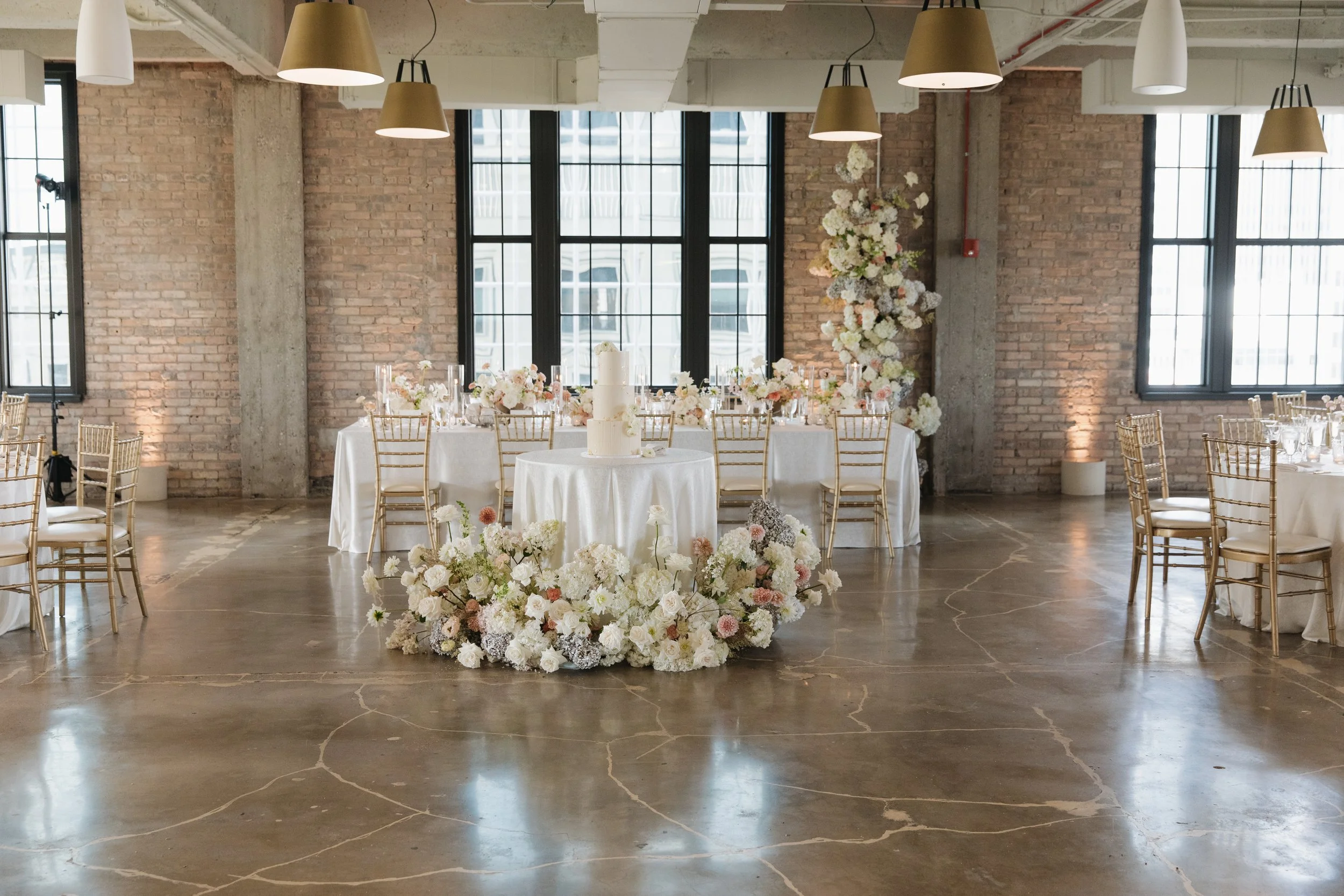Danielle and Tim's wedding epitomized luxury and sophistication, meticulously orchestrated by Details Chicago. Hosted in a premier Chicago venue, the celebration showcased opulent floral arrangements, exquisite décor, and a refined ambiance. The even