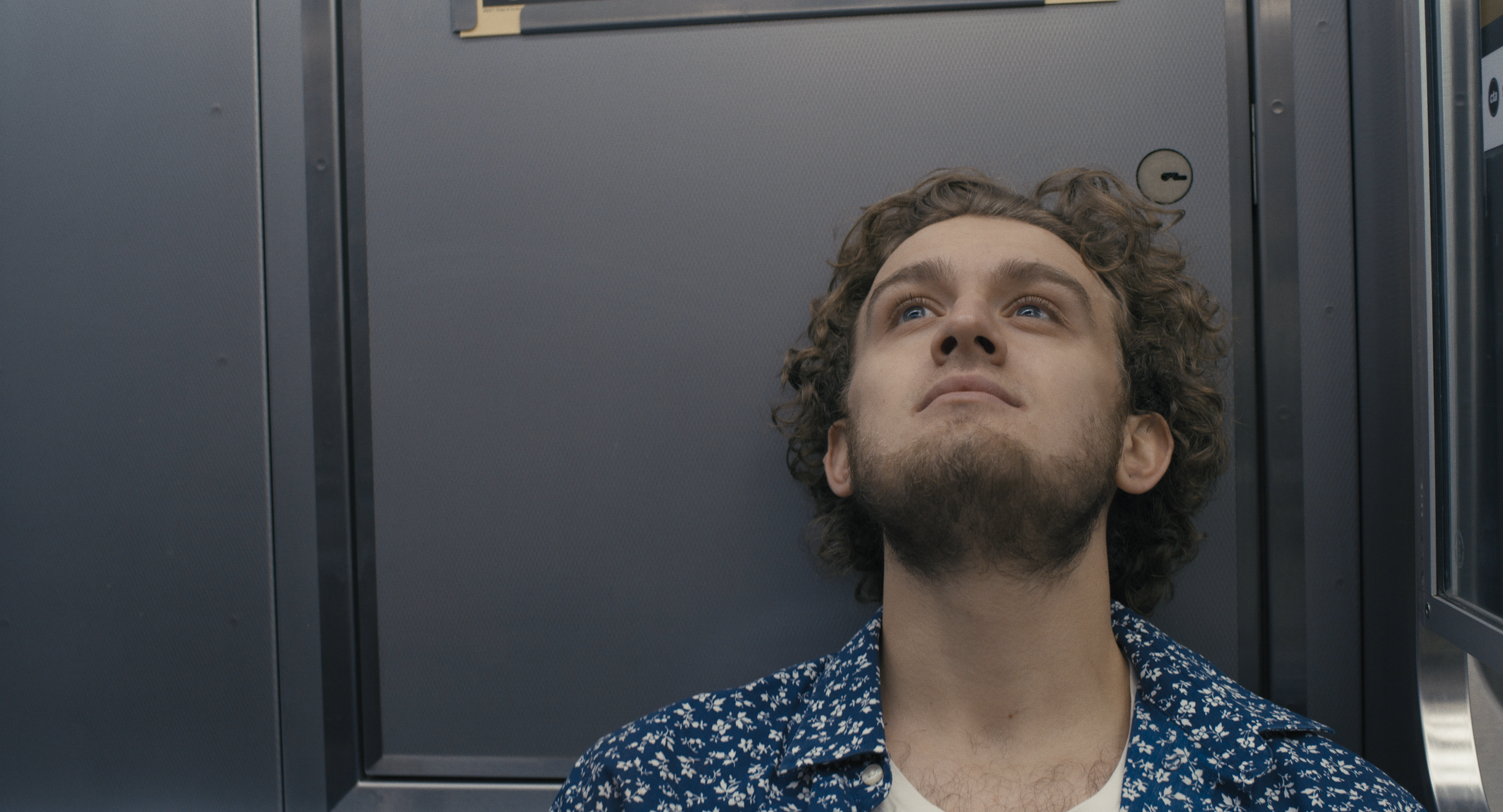 Floyd in train lookin up.png