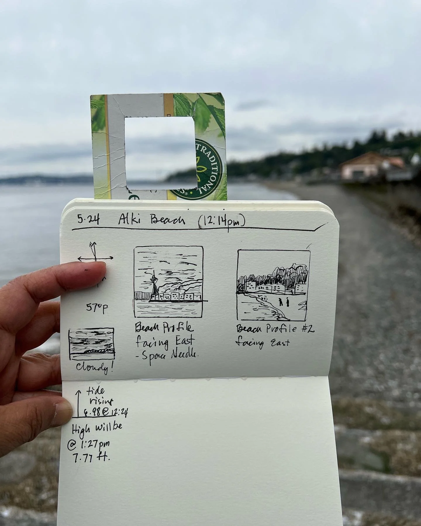 small sketchbook with line drawings in square frames of the distant landscape, a view finder