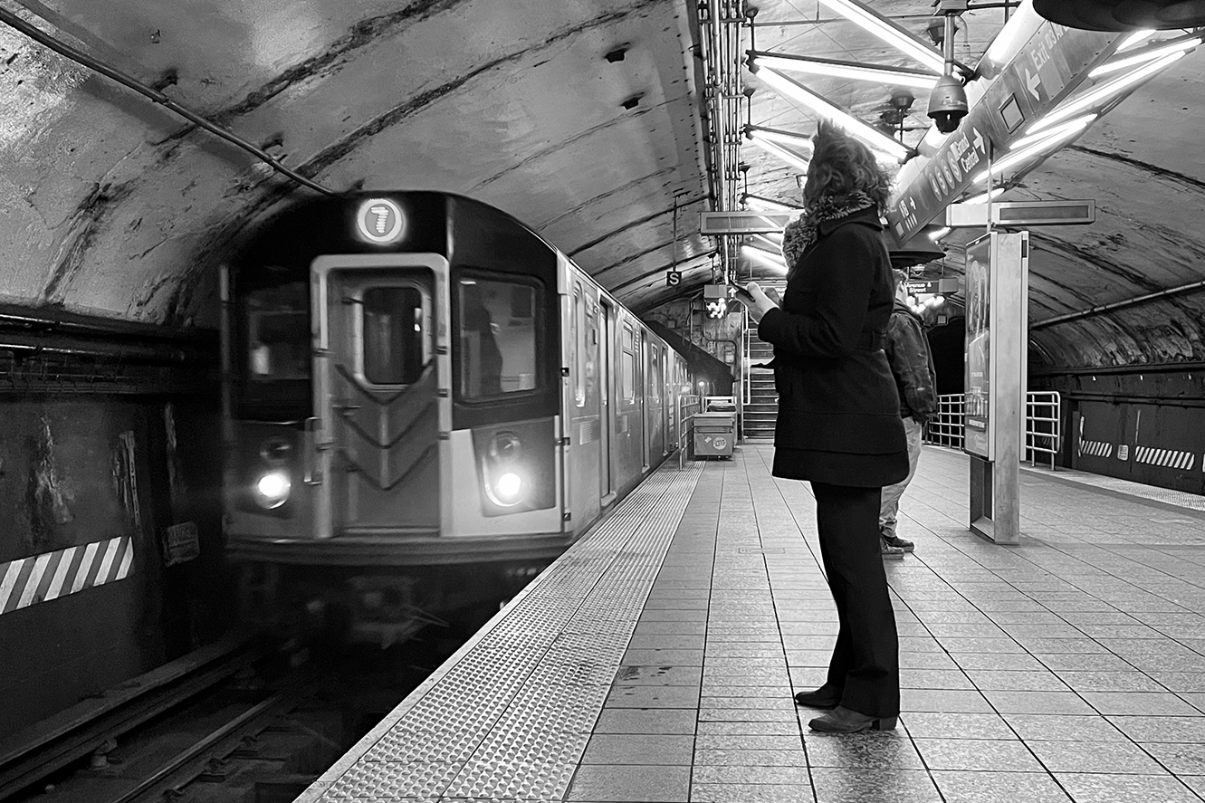 new york city subway train platform nyc woman waiting