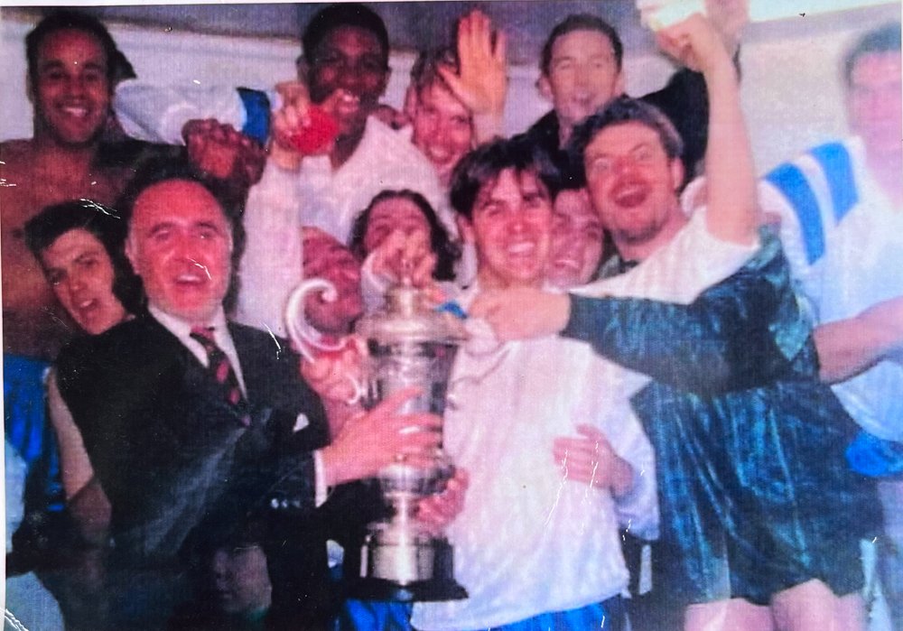Presenting the winners trophy to his son Cary's football team