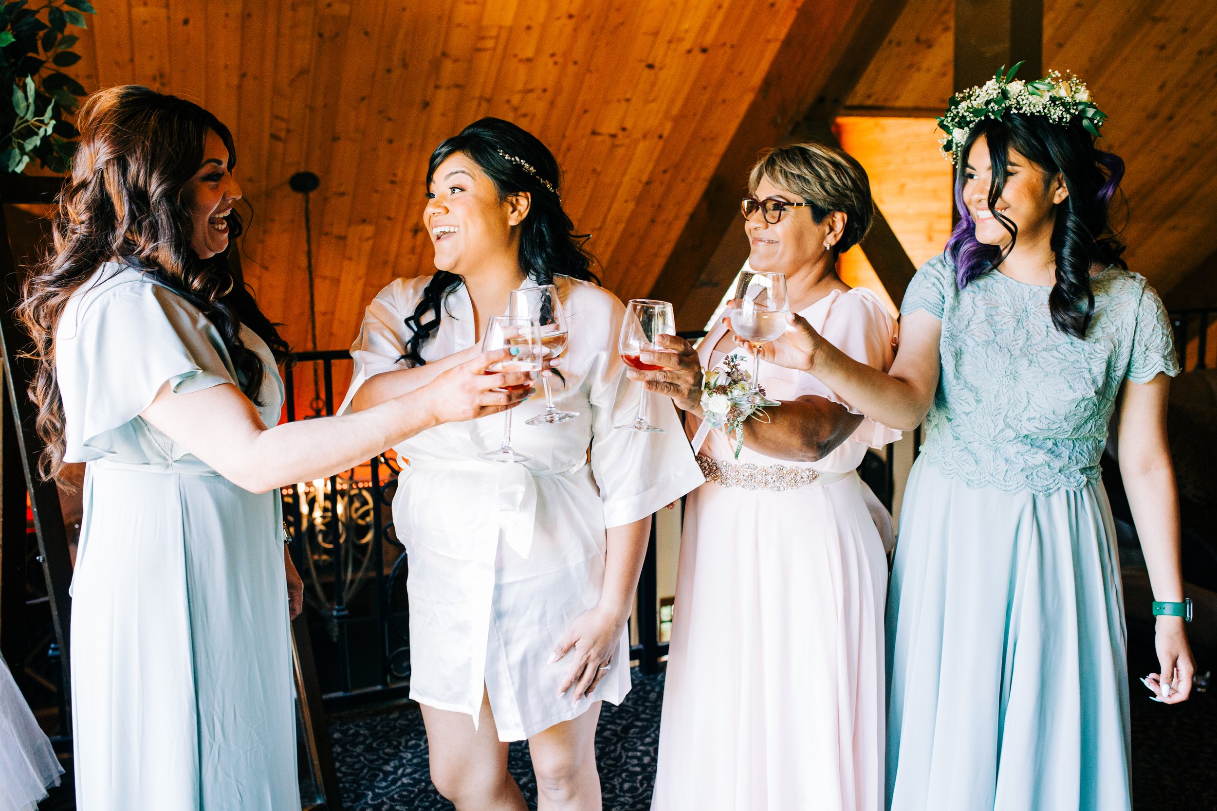 bride with bridesmaids drinking champagne.jpg