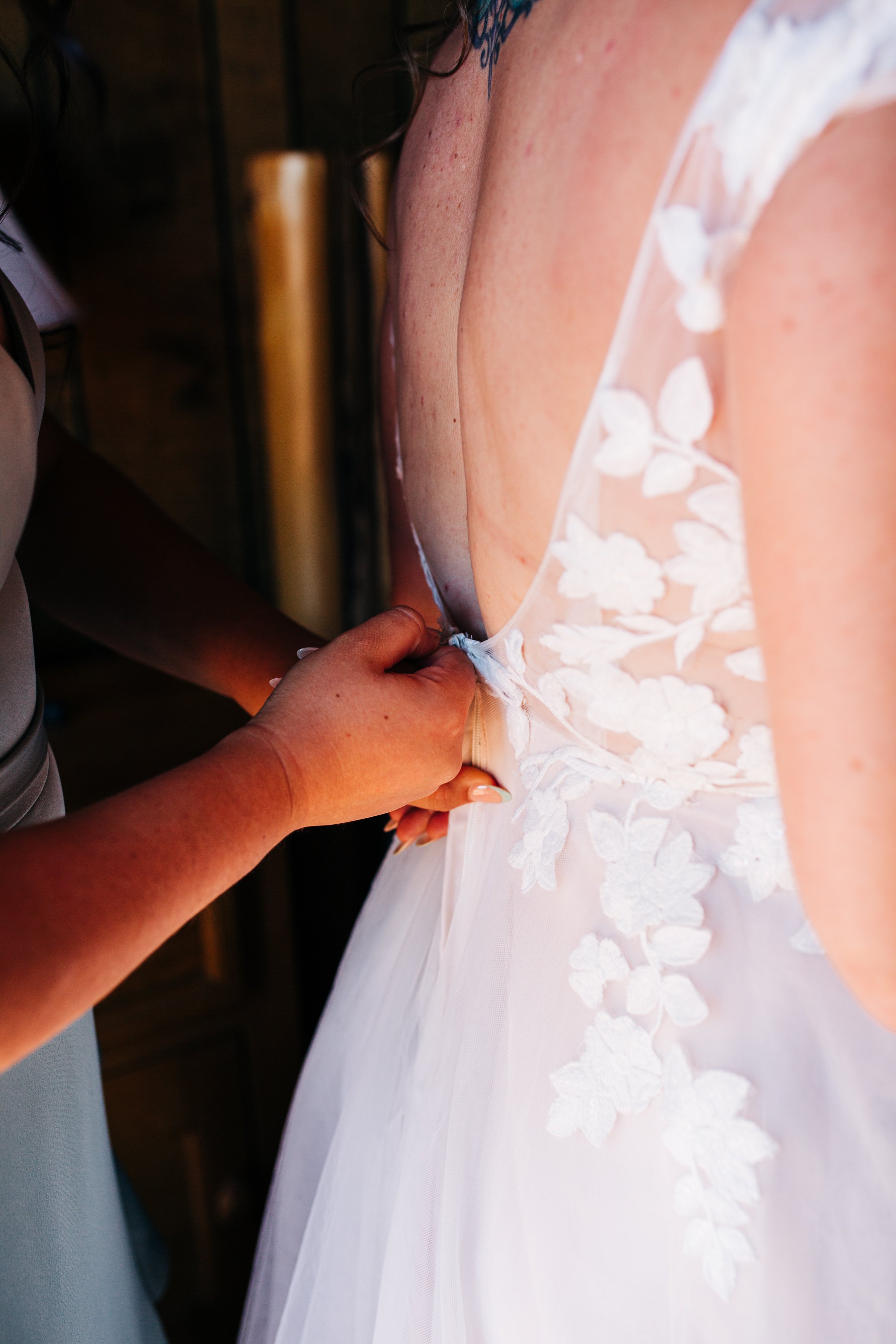 zipping brides dress.jpg