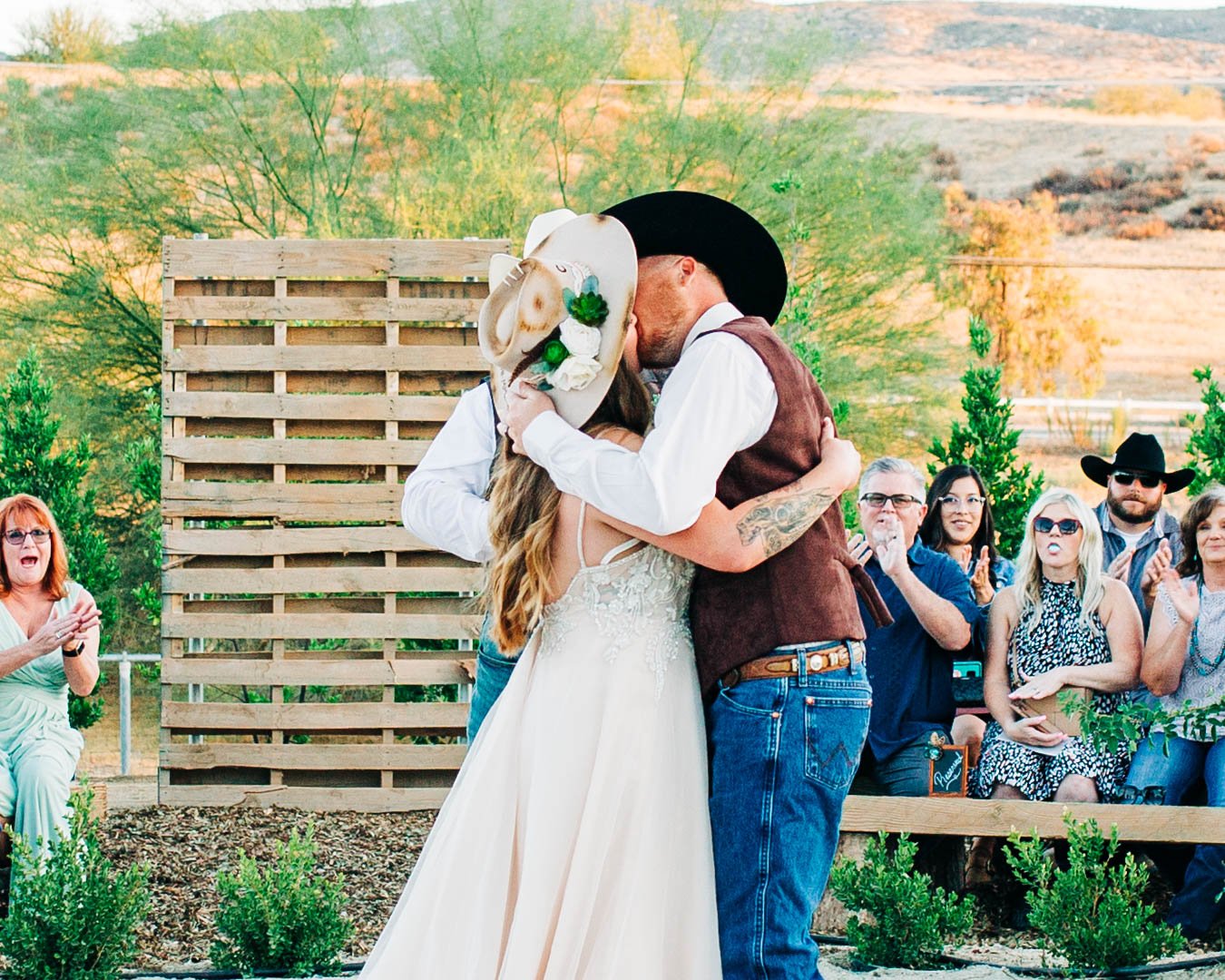 bride kissing groom cowboy.jpg