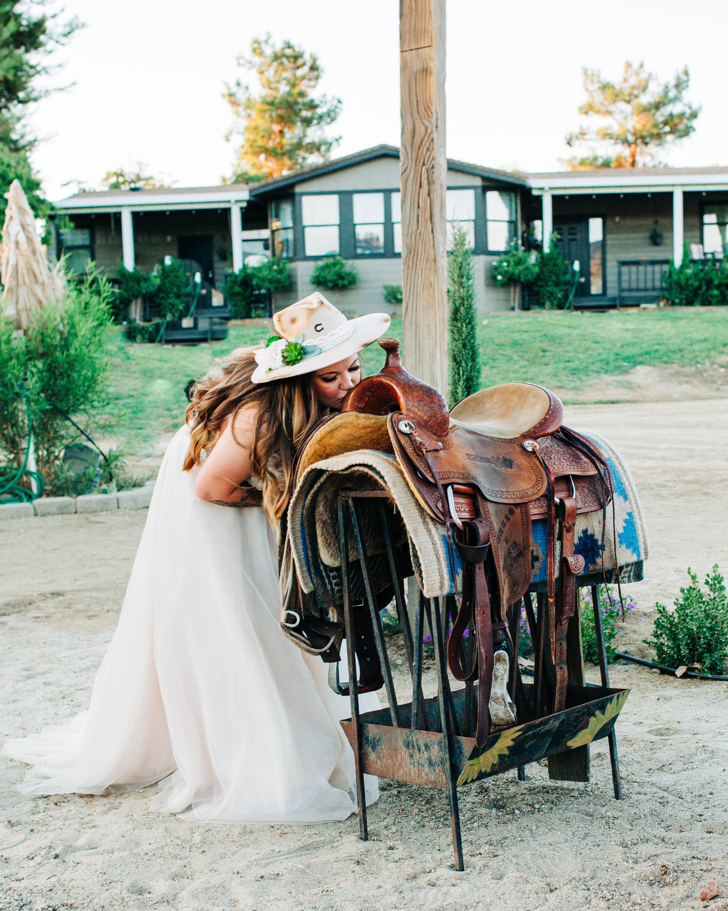 bride kissing saddle.jpg