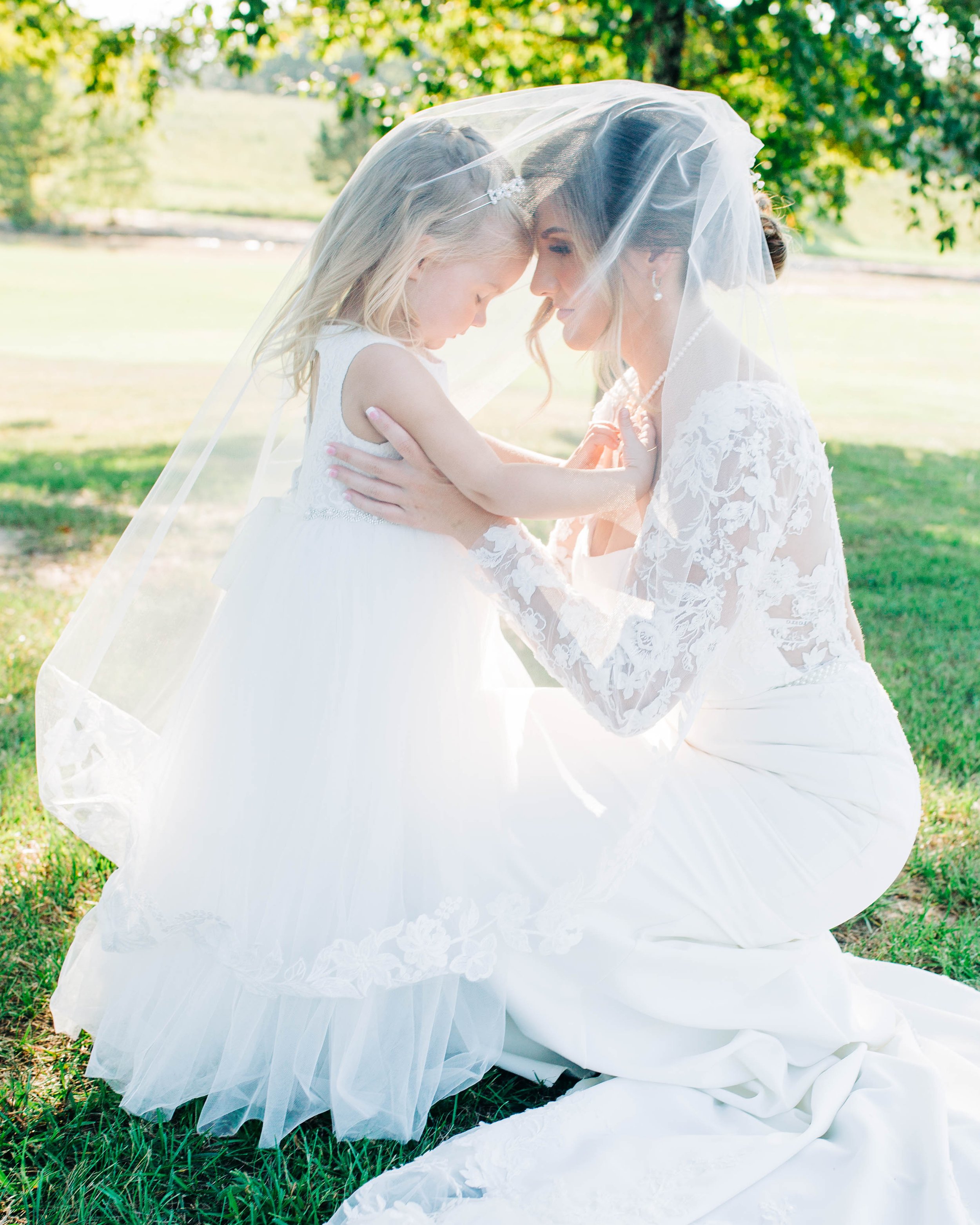 bride with daughter under her veil.jpg