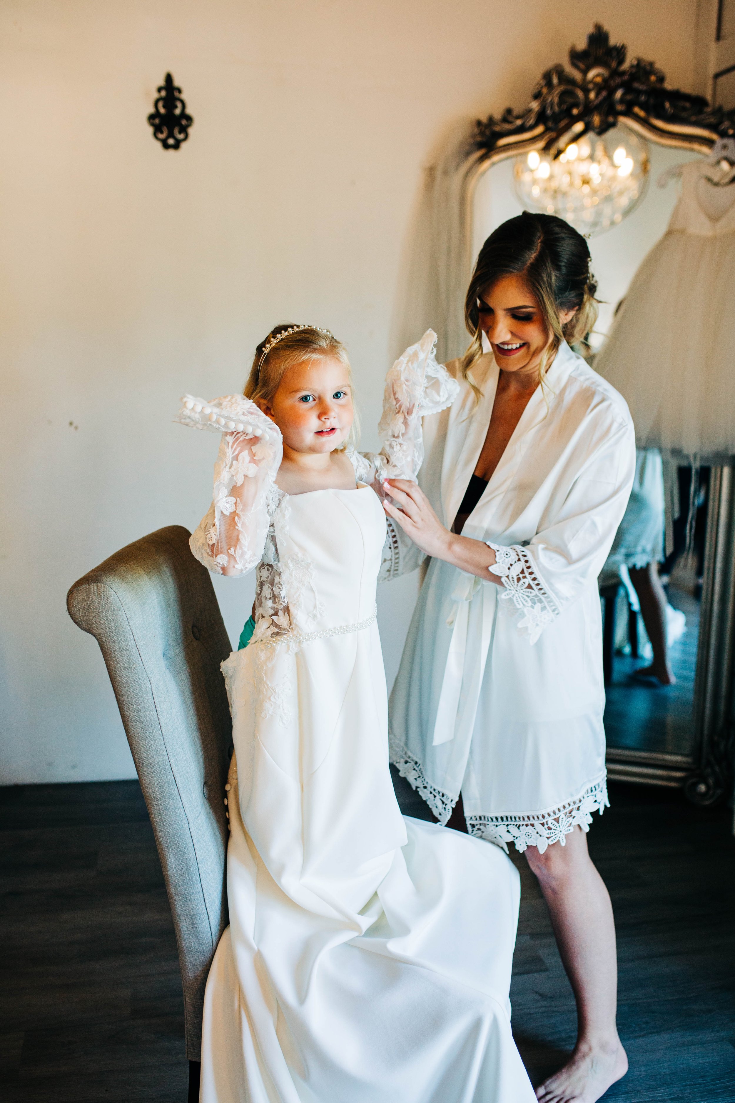 daughter trying on mother's wedding dress.jpg