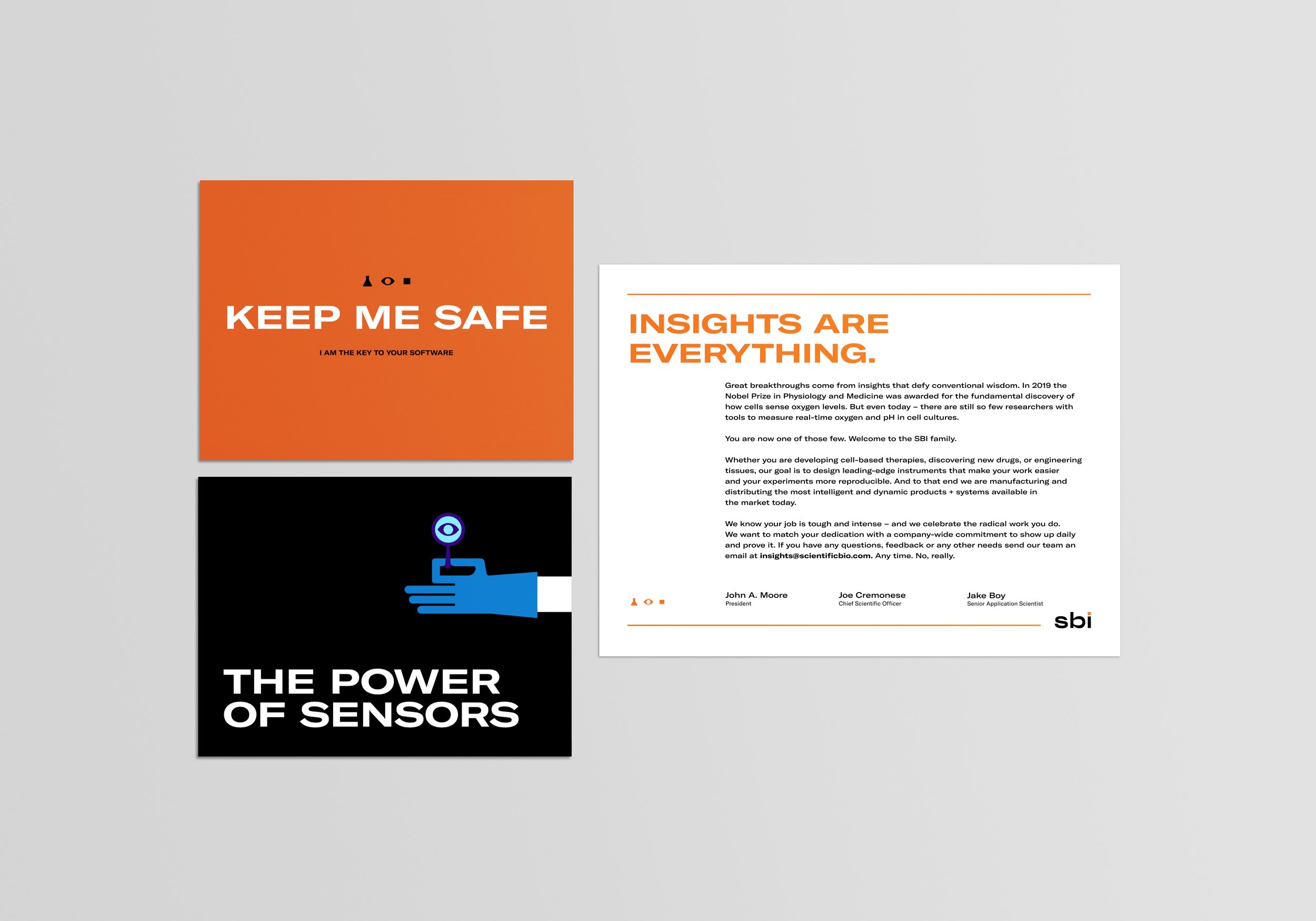Two informational posters and one document on a gray surface. The top left poster has an orange background with white text: 'KEEP ME SAFE' and smaller text below: 'I AM THE KEY TO YOUR SOFTWARE.' The bottom left poster has a black background with an illustration of a blue hand holding a test tube and text that says 'THE POWER OF SENSORS.' The right document contains text in orange and black, with a heading in bold orange: 'INSIGHTS ARE EVERYTHING.'