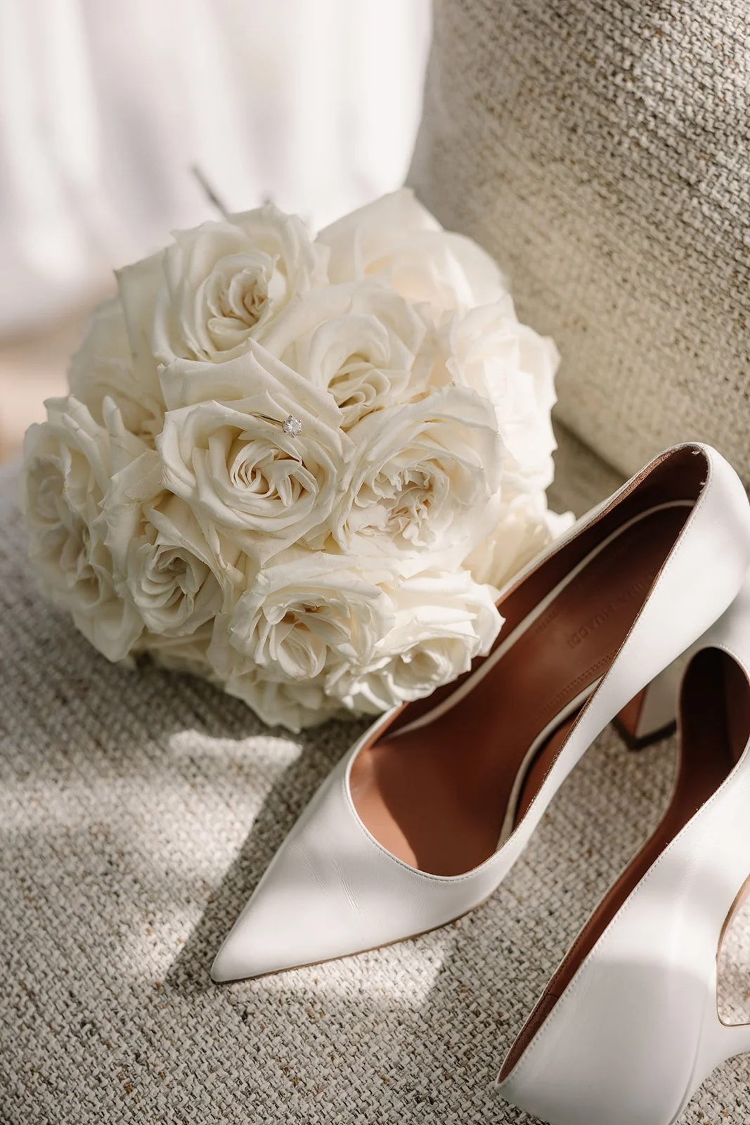 Bridal bouquet and shoes at Livi & Asher's wedding in Tasman