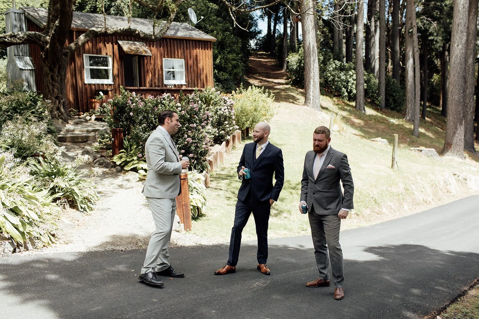 Groom and groomsmen outside the lodge at Pete & Kelsie's wedding at Mt Vernon Lodge, Akaroa
