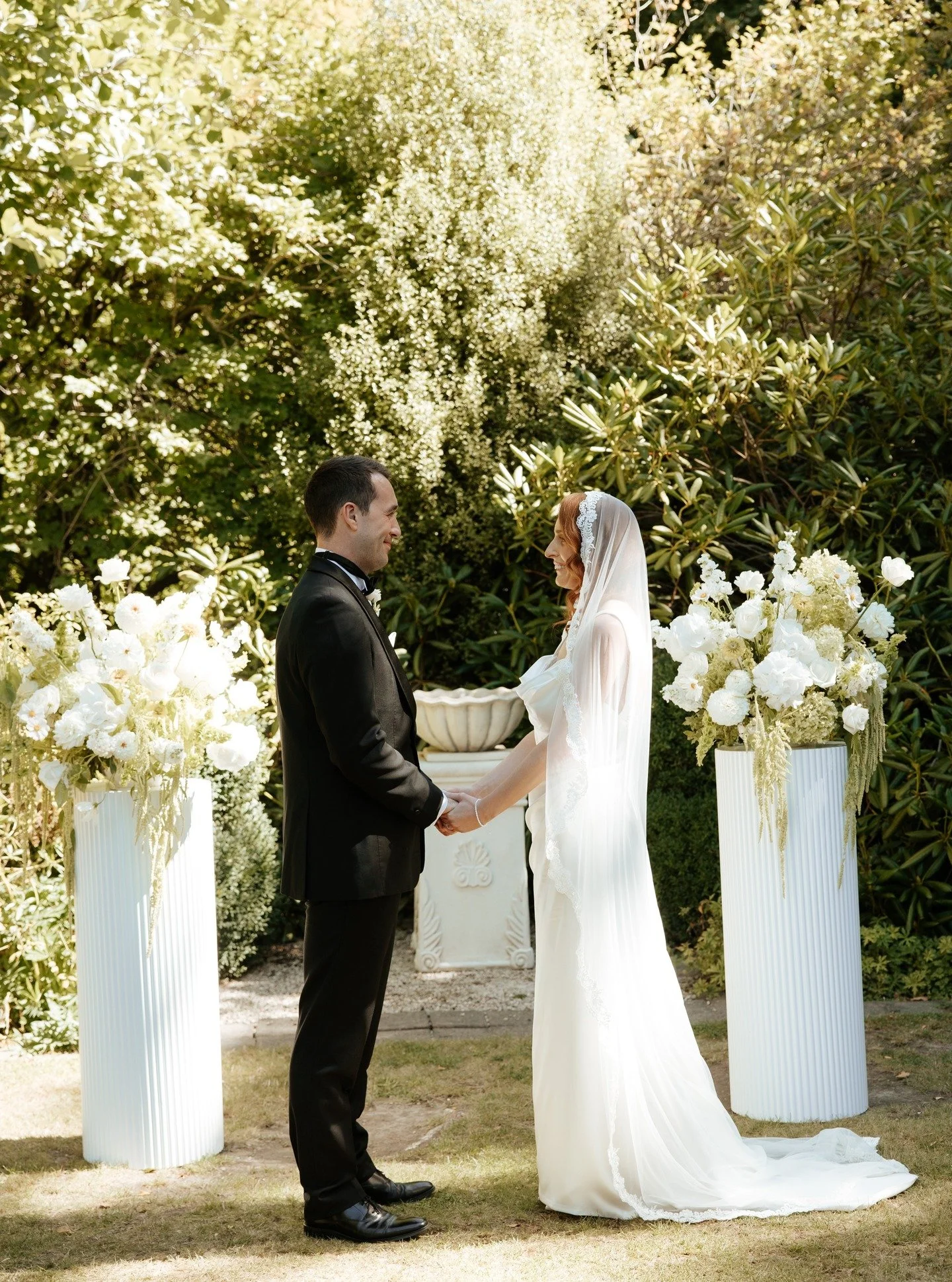 Some fluffy white and green florals for M &amp; R on our white ribbed plinths. Easy as that!