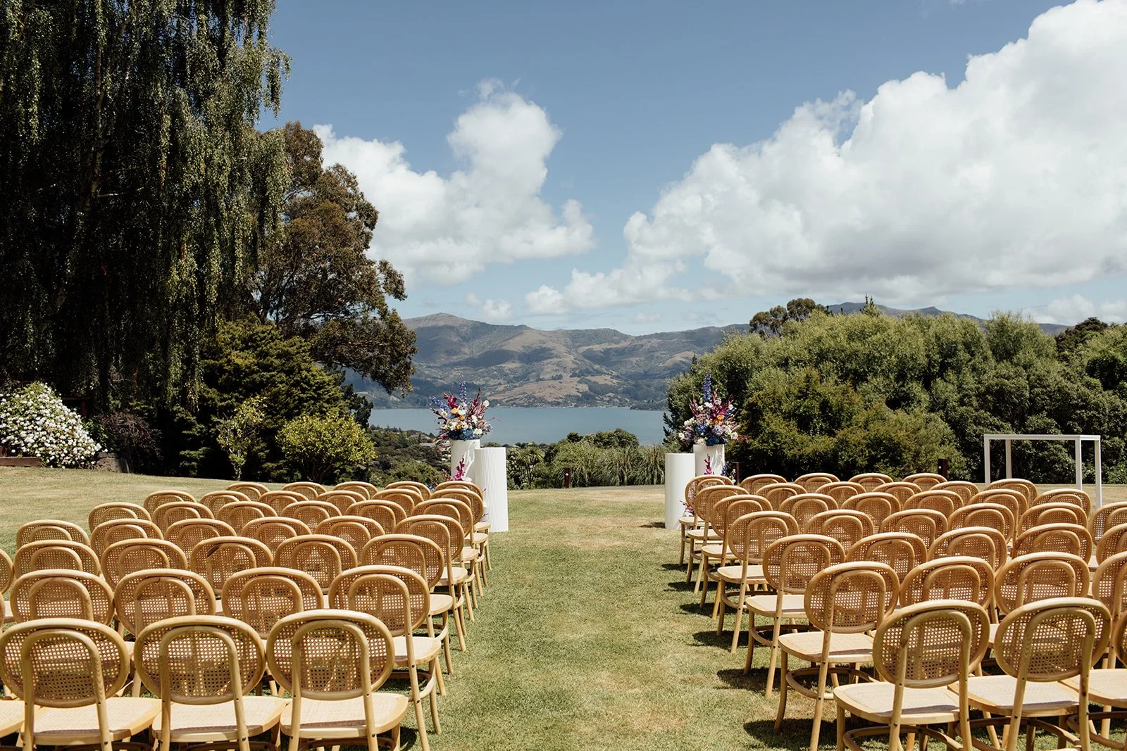 Ceremony seating overlooking Akaroa Harbour at Pete & Kelsie's wedding at Mt Vernon Lodge, Akaroa