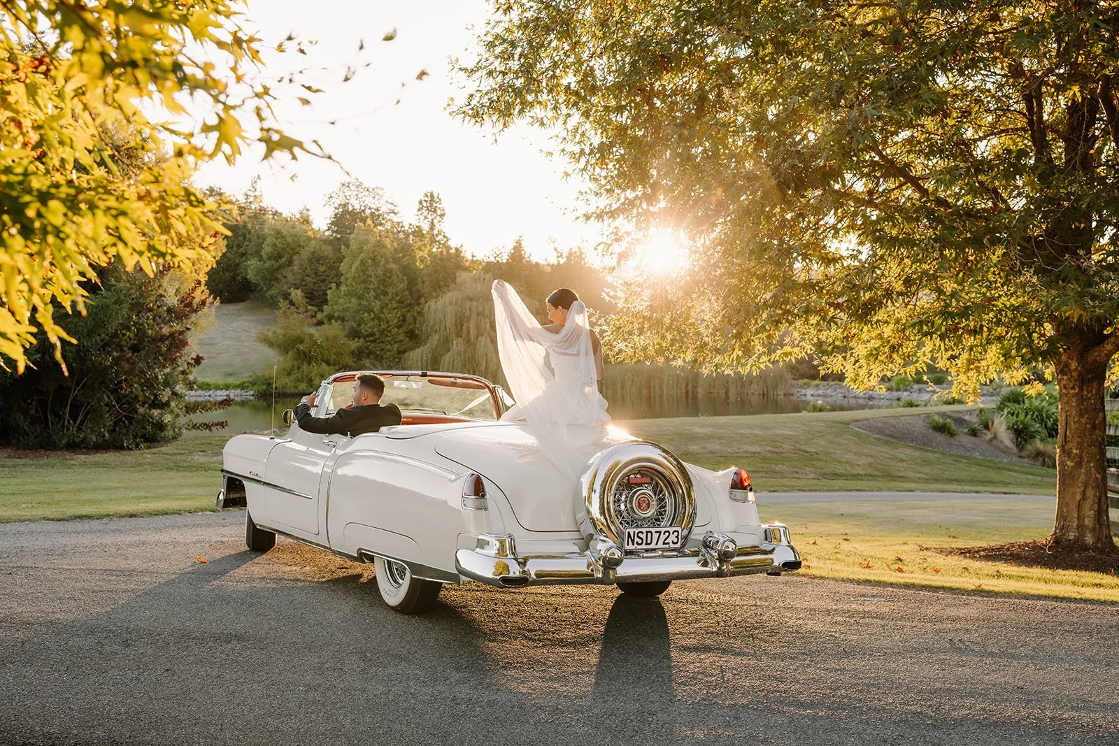 Vintage wedding car at sunset at Livi & Asher's wedding in Tasman
