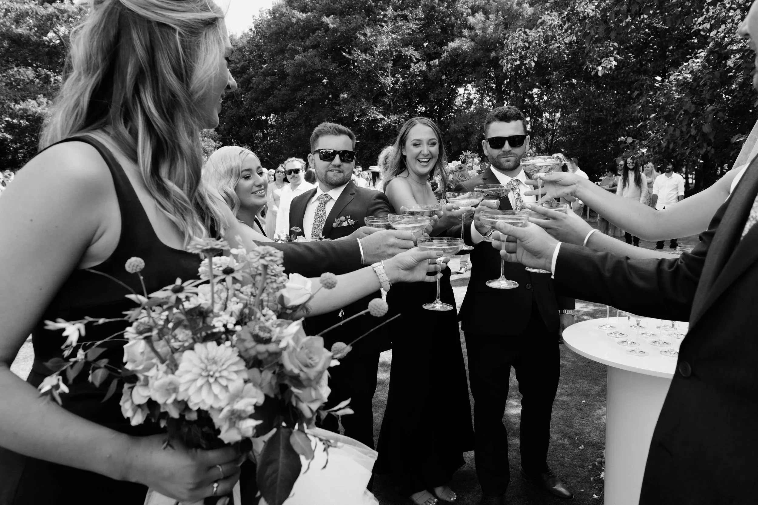 Wedding guests raising a champagne toast – Loula Event Hire