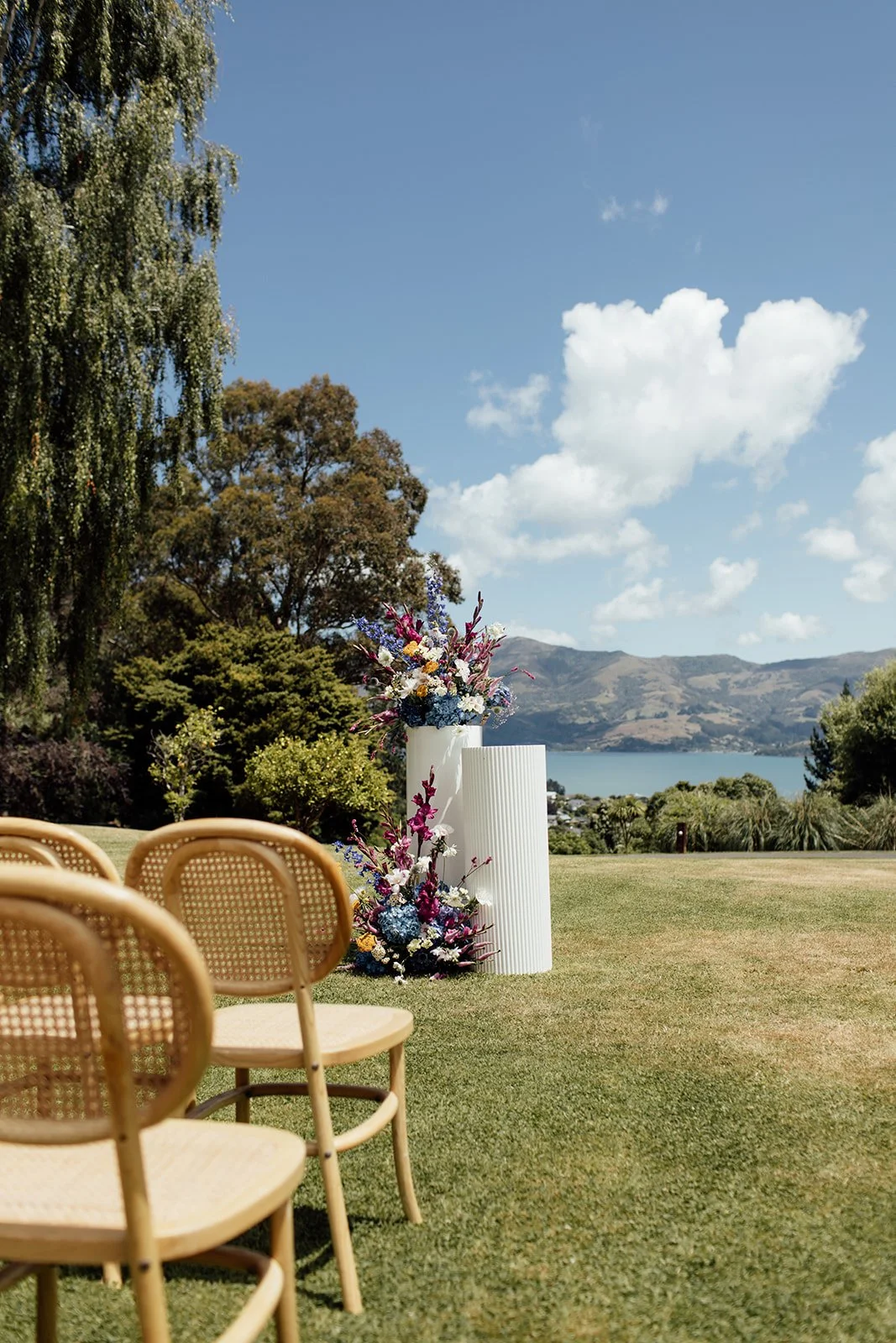 Ceremony seating with harbour views at Pete & Kelsie's wedding at Mt Vernon Lodge, Akaroa