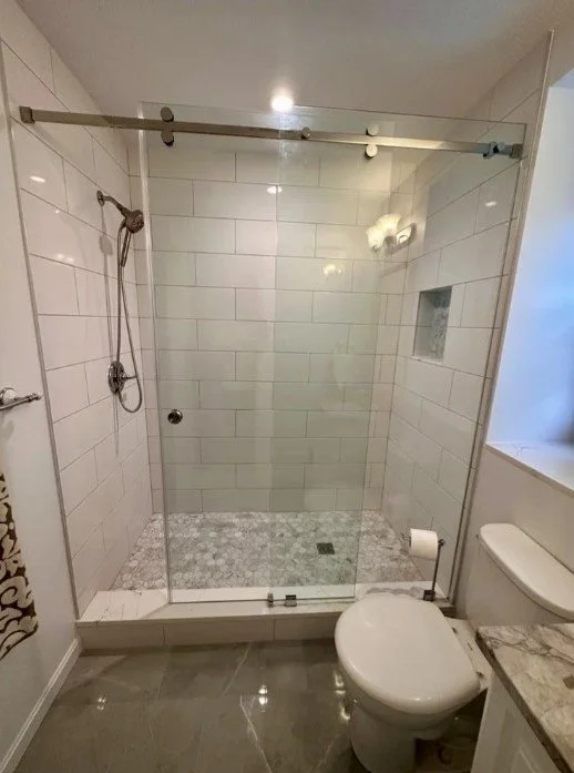 Shower with designer tile and frameless shower glass in Fairfax, VA
