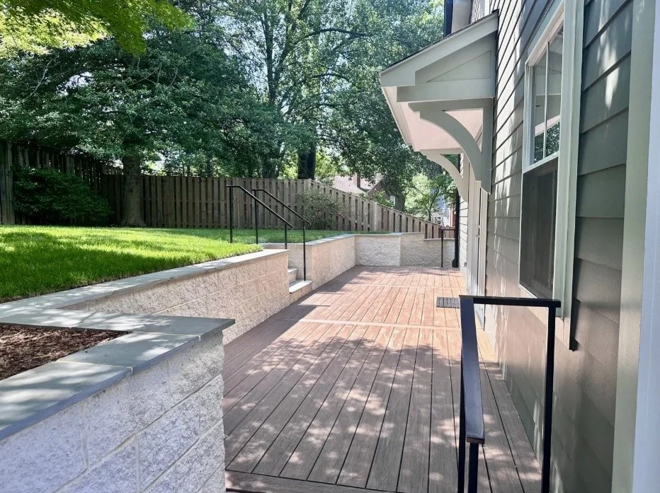 Renovation and addition of a backyard patio with a wooden deck in Arlington, VA