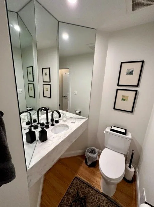 Powder room with custom mirrors and quartz countertops in Old Town Alexandria