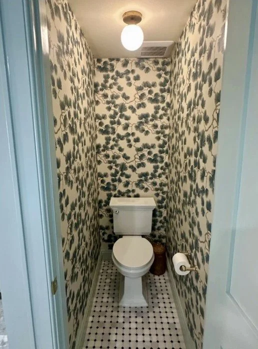 Powder room with wallpaper and mosaic tile floor in Arlington, VA