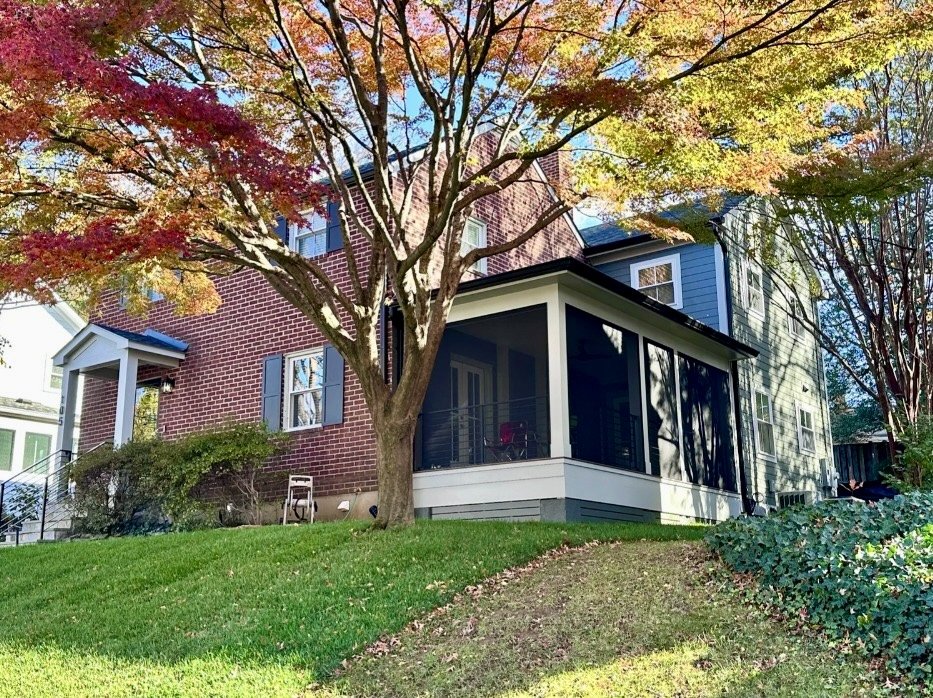 Renovation and addition fo a house with a screened porch, brick and blue siding exterior in Arlington, VA