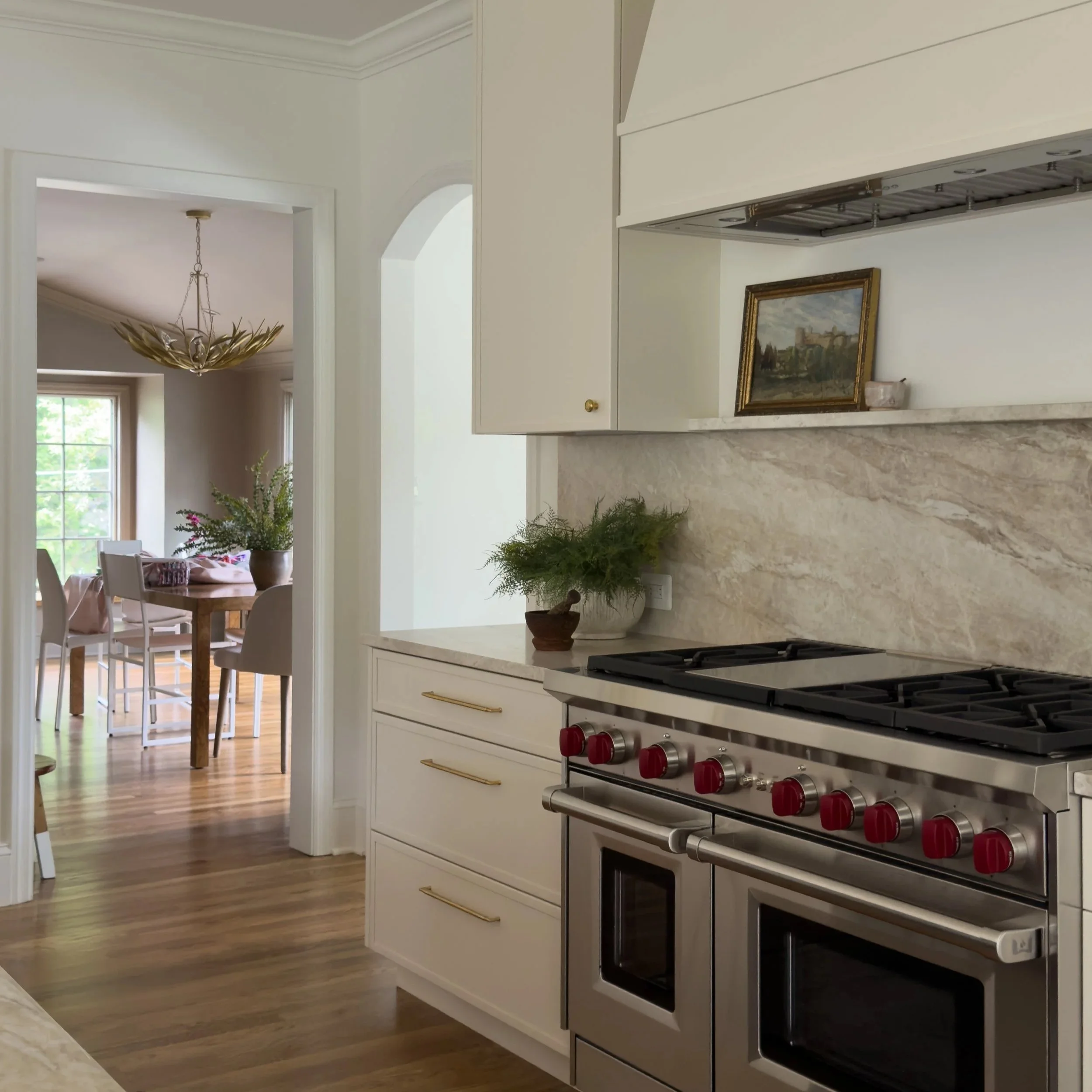 Custom kitchen renovation with Taj Mahal quartzite countertops, wolf range, and custom kitchen cabinets