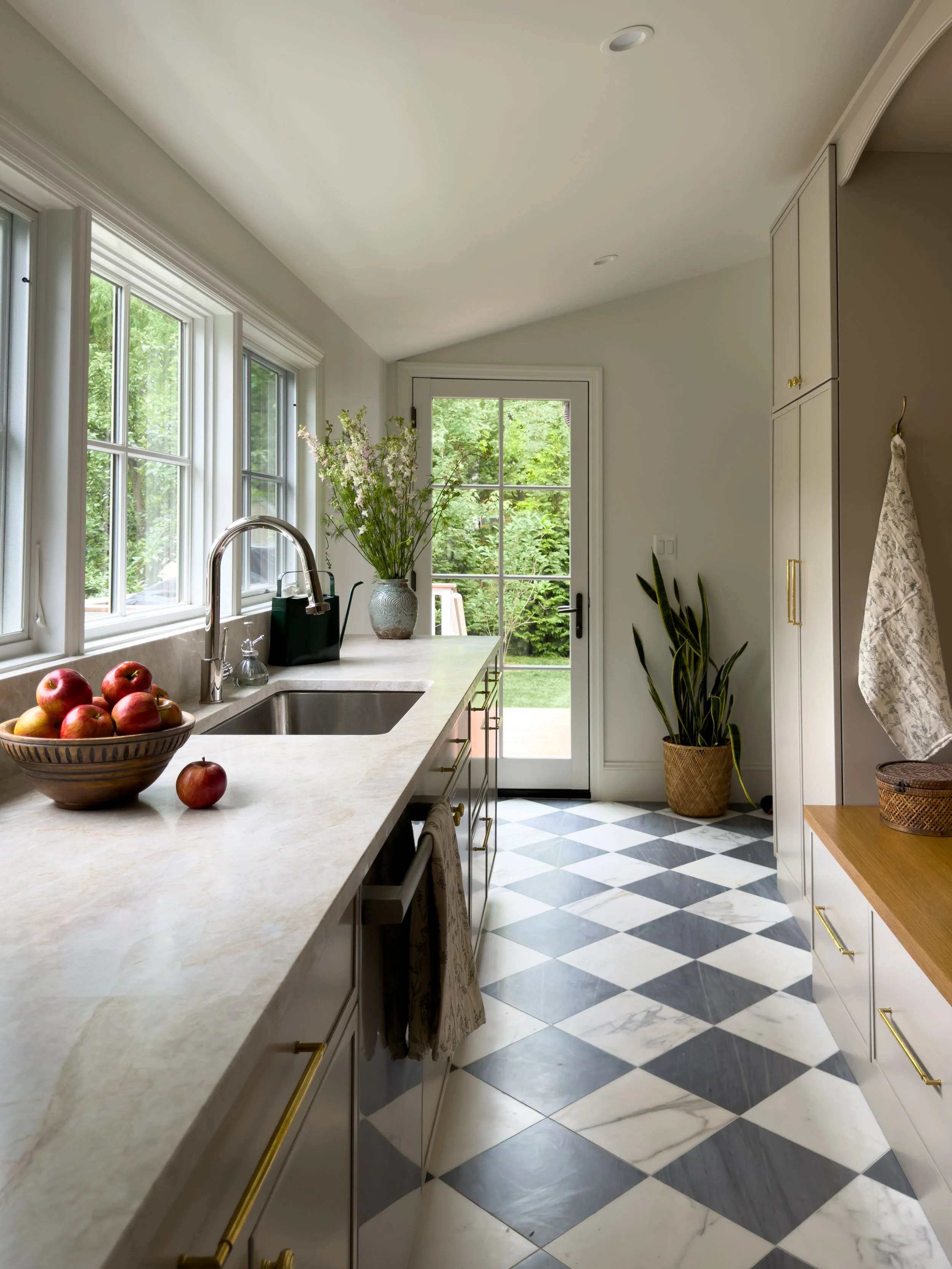 Custom Scullery with Marble Floors and Taj Mahal Quartzite Countertops