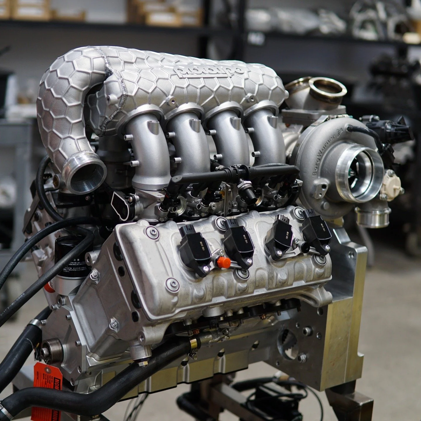 Our 3D-printed aluminum intake plenum is now machined and test-fitted on the 2.3L turbo V8 for @robin.shute. Built to handle the extreme demands of Pikes Peak, every detail is designed for strength, airflow, and performance, working alongside a @borg
