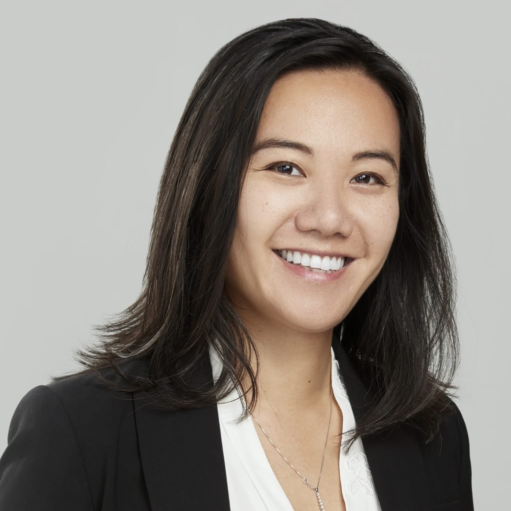 headshot of Ada Chen, a woman with straight dark hair, dressed professionally and smiling