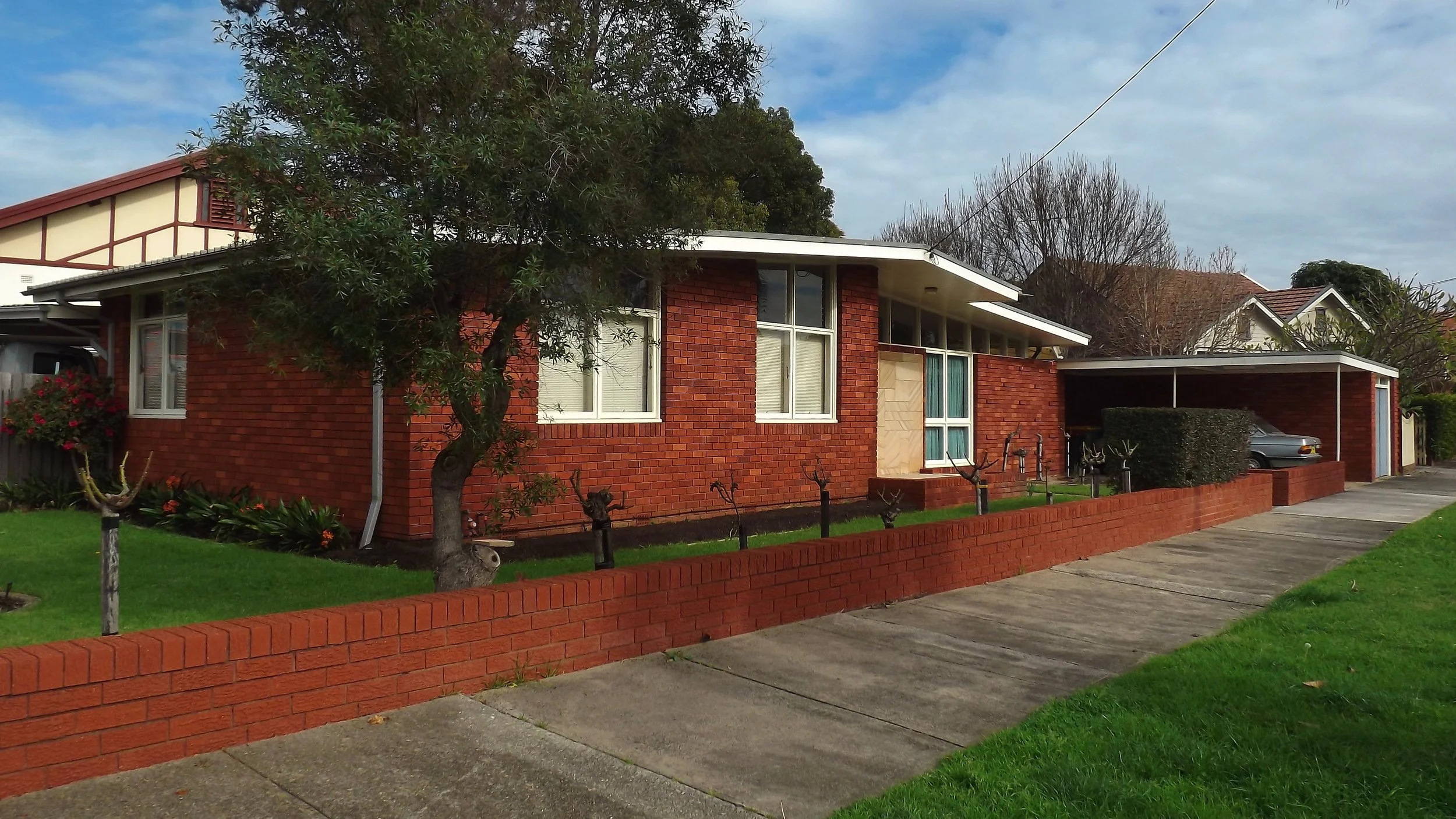 Classic Australian brick home representing a family estate or inheritance asset.