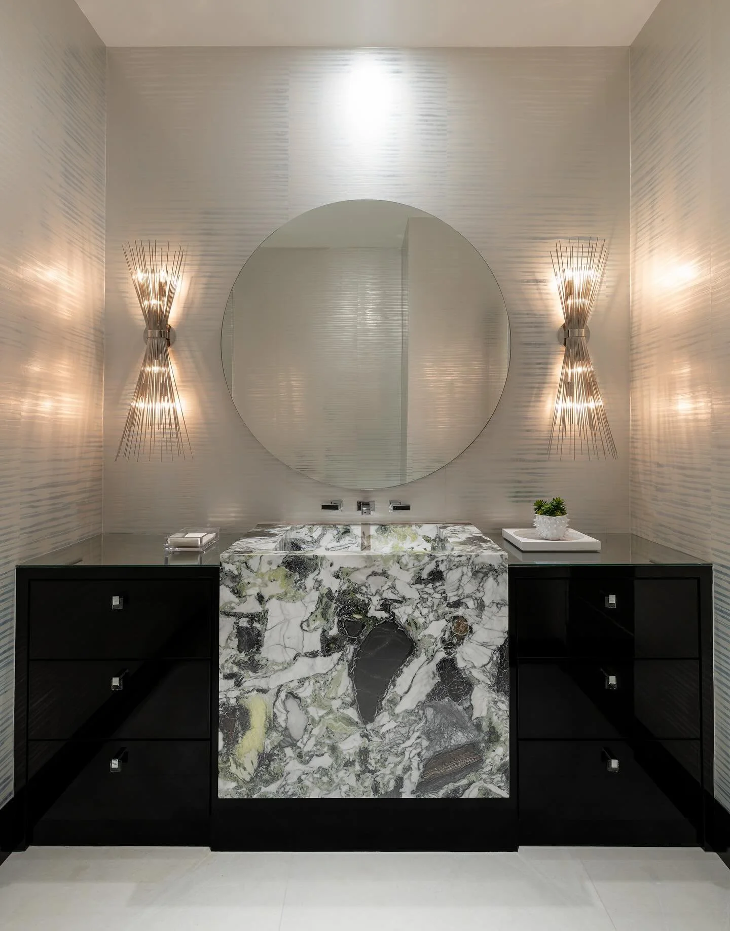 Luxury in the details 💎 &hellip; 📸: @piassickphoto . . . #dallasdesigngroup #ddg #dallasinteriordesign #interiordesign #luxuryinteriors #luxurybathroom #bathroomdesign #luxuryvanity #vanitydesign #vanitydetails #customvanity #sconces #wallpaper