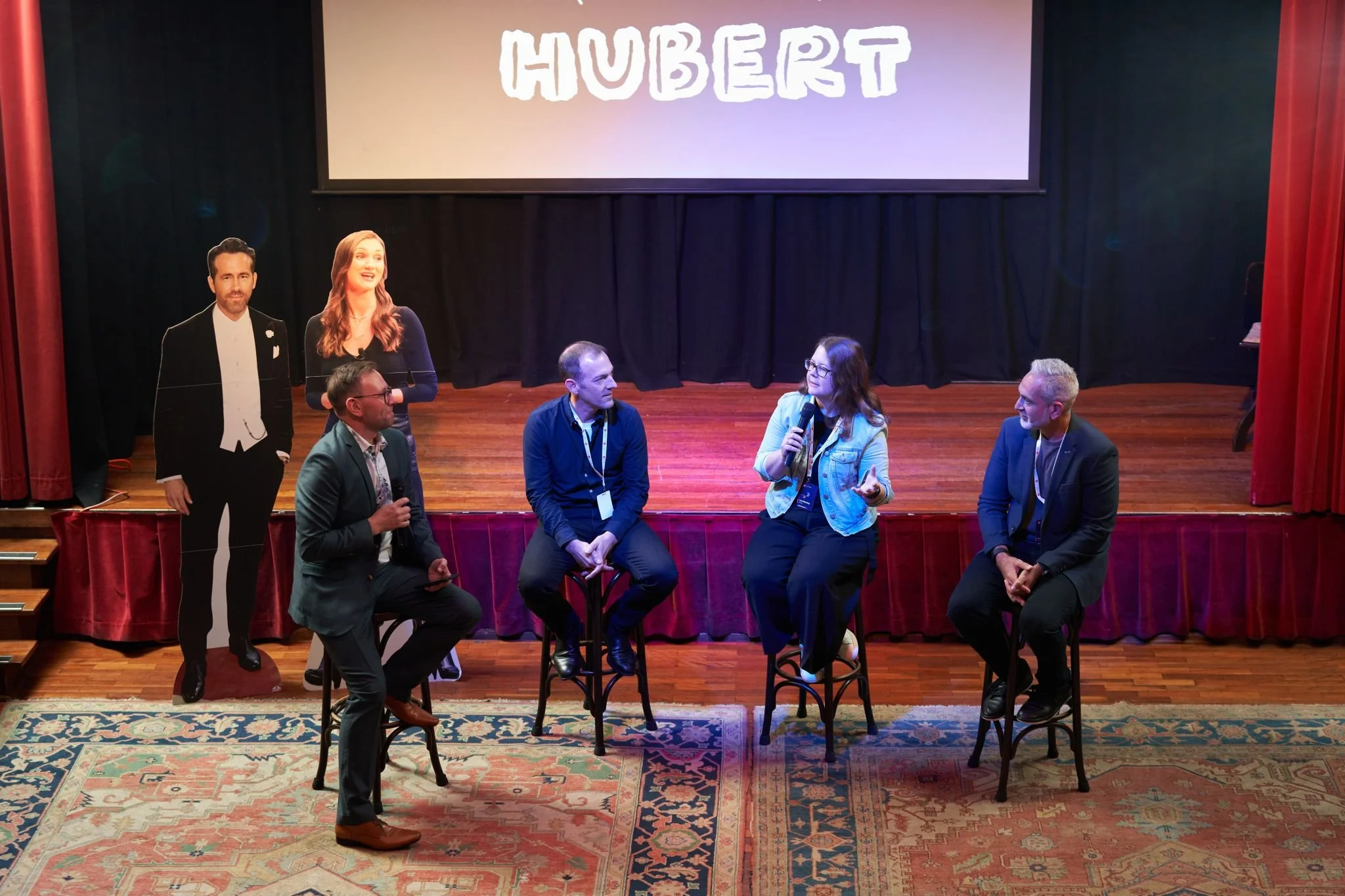 Image of Launch APAC owned event and executives speaking on stage