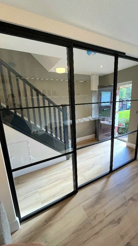 Our client wanted open-plan feel and to maximise natural light throuout the space. Instead of opting for a traditional stud or block wall, they chose a beautiful glass wall with sliding door, creating a sense of openness and extra space in the living