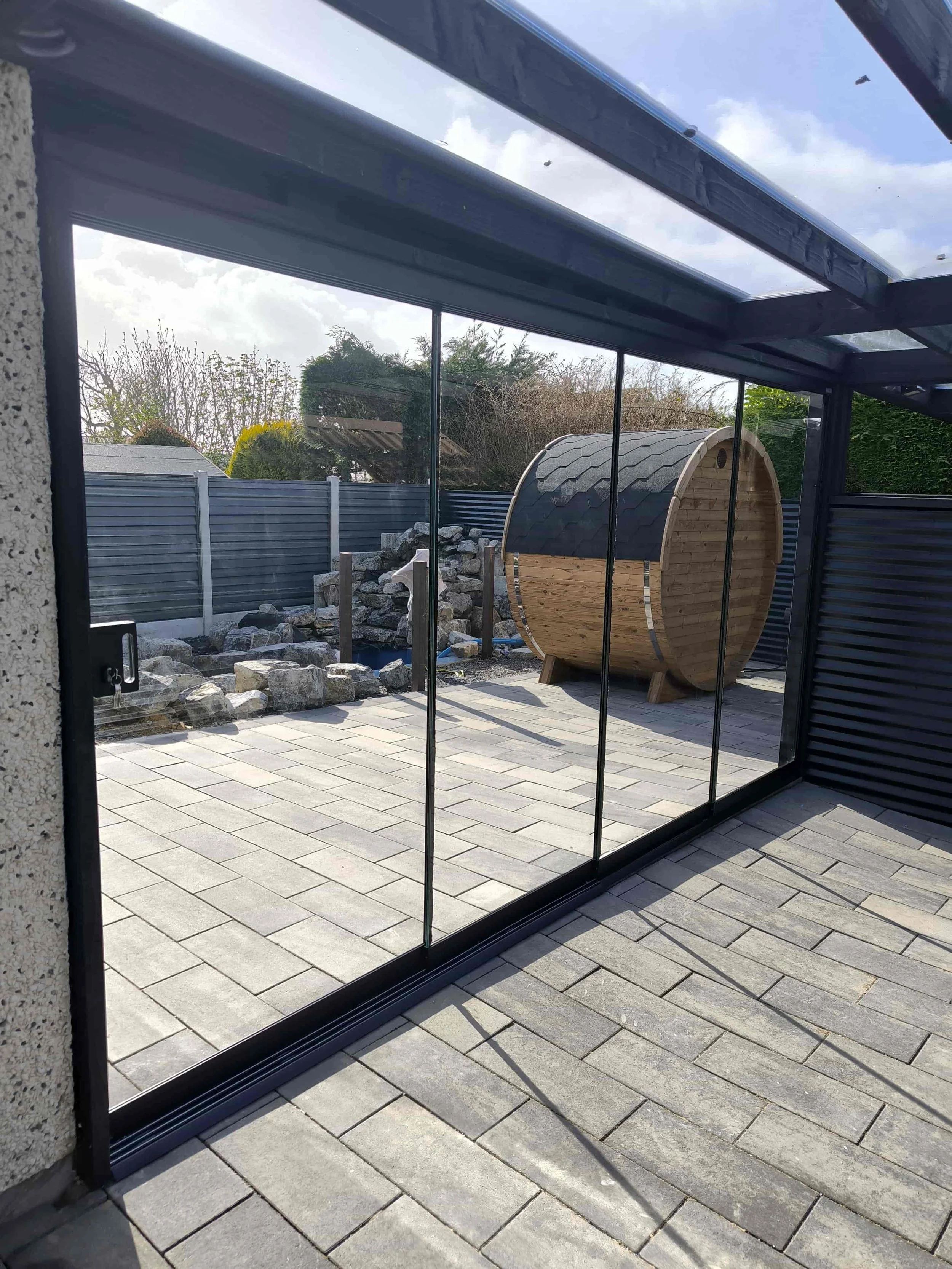 Modern outdoor patio area closed off using a glass partition from Seeglass Run 3