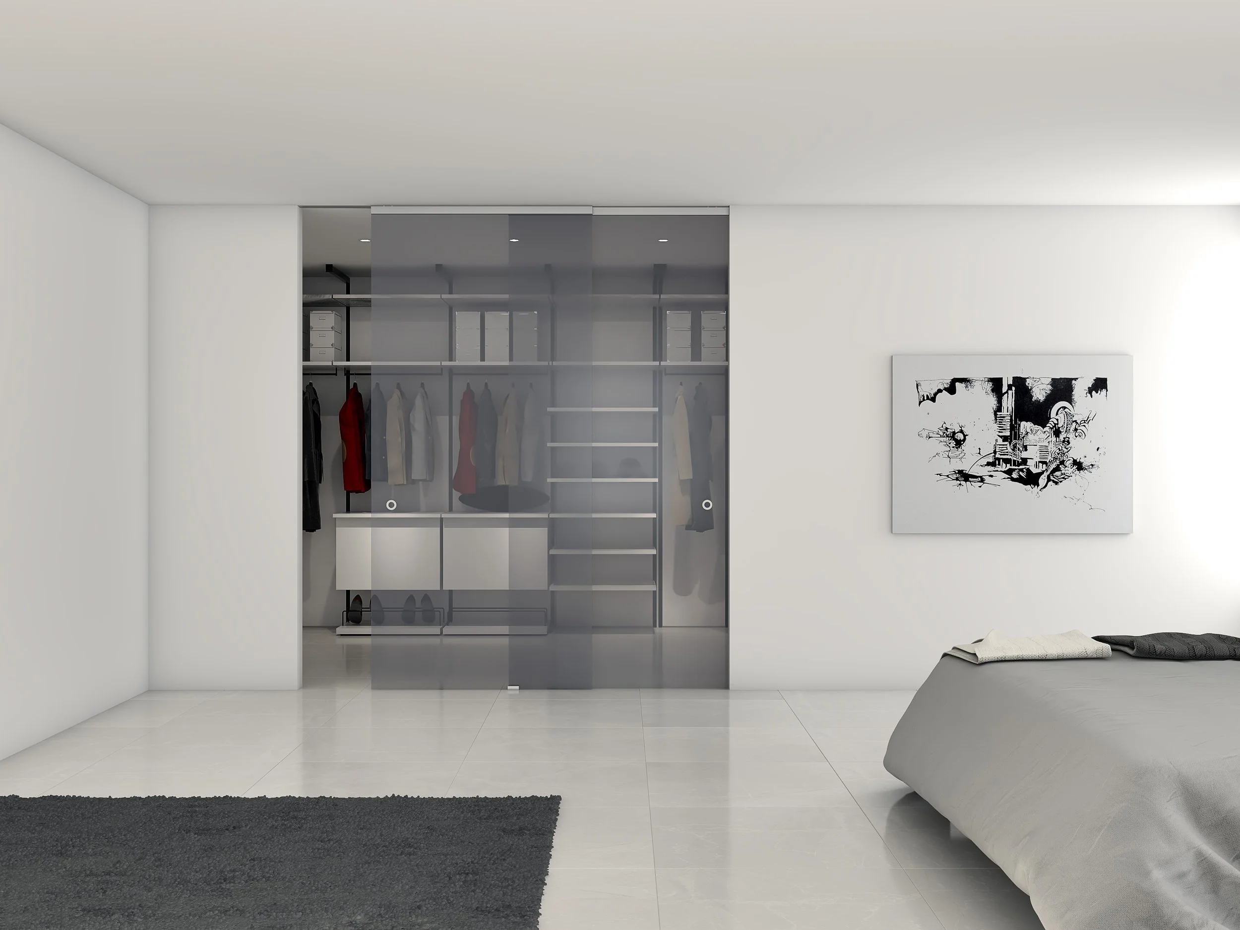 Modern bedroom with white walls, a bed with gray bedding, a black and white abstract artwork on the wall, a black rug on the floor, and a walk-in closet with sliding glass doors in the background.