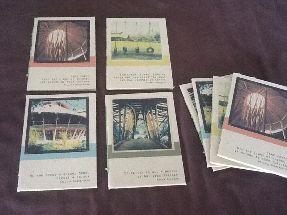 greenschool merchandise hand made recycled paper notebooks with greenscholl imagery