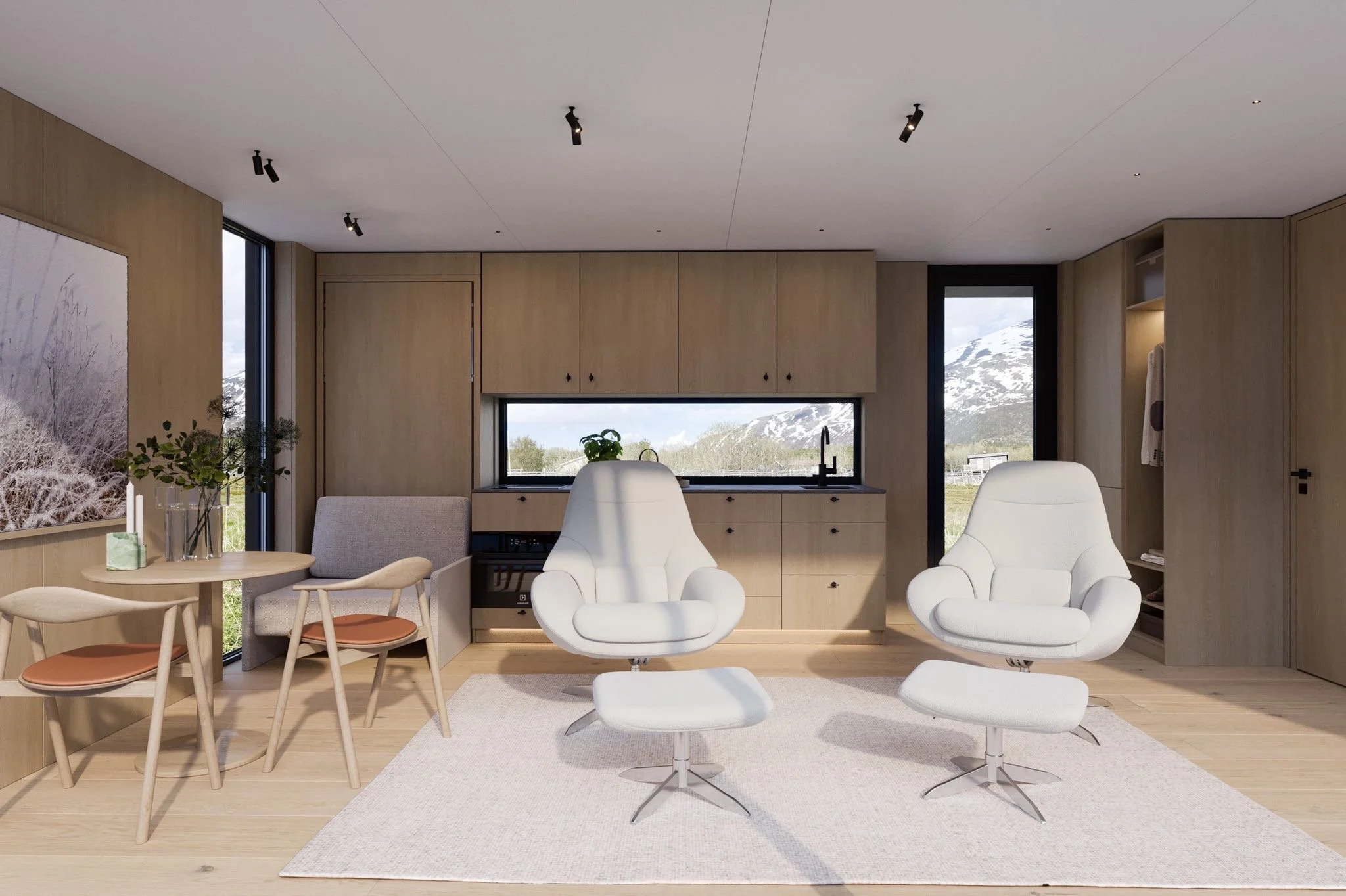 Modern living room with white chairs, a round wooden dining table with chairs, and large windows showing mountains with snow.