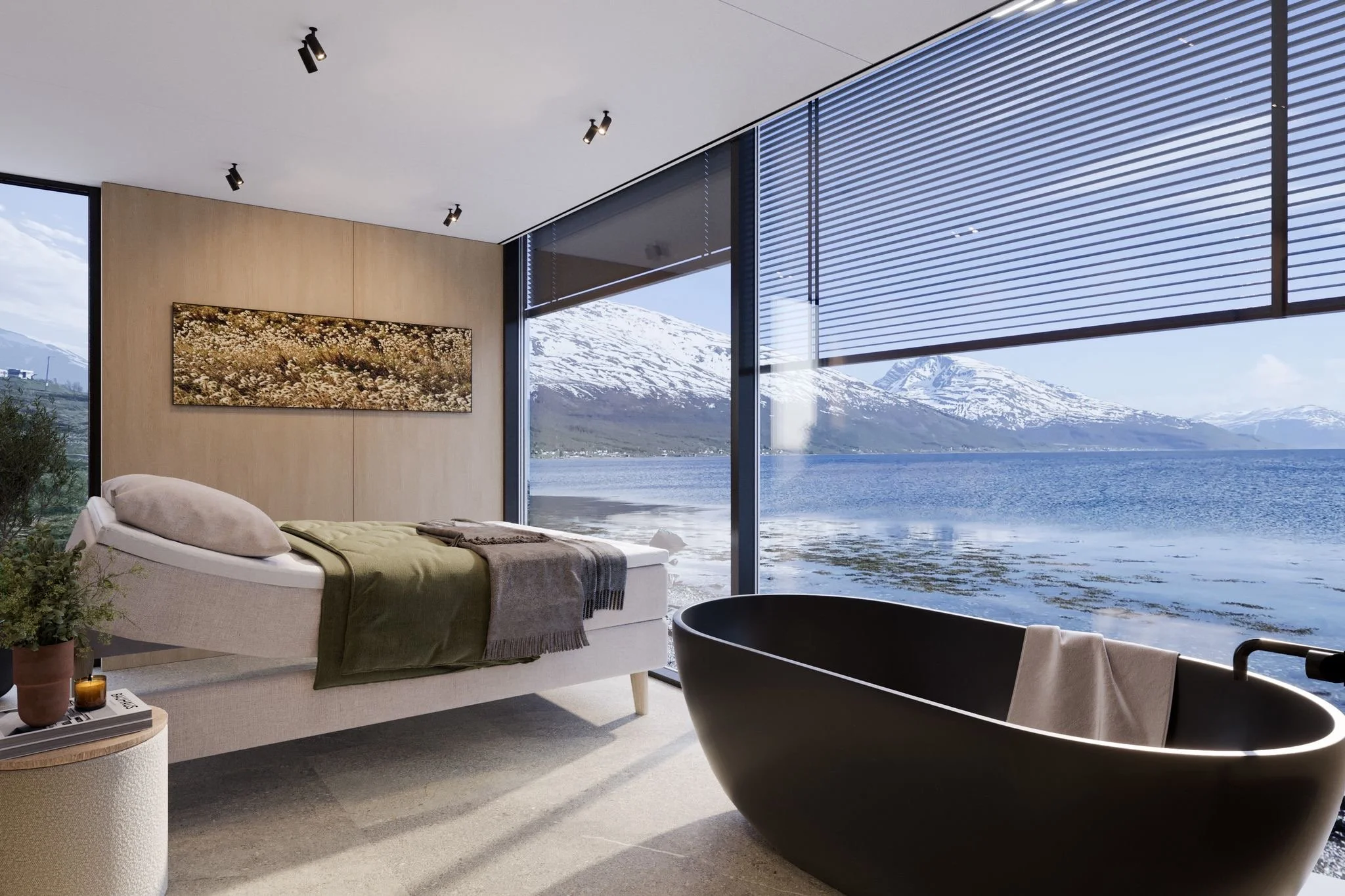 Modern bedroom with large floor-to-ceiling windows overlooking mountains and a body of water, featuring a bed with green and beige bedding, a black bathtub, a wooden side table with candles, and a landscape painting on the wall.