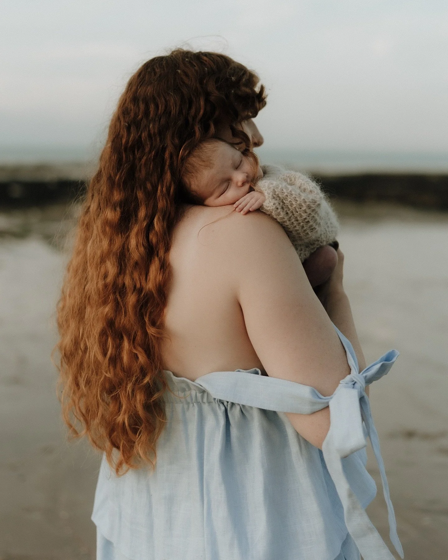 Baby Kade and his incredible mama - the fourth of the family. 
2 weeks after birth by the water, a babies safe space. Nestled in mamas hair with natures white noise 🌊 singing him to sleep. A divine scene. 
I think 2025 has been the year I’ve