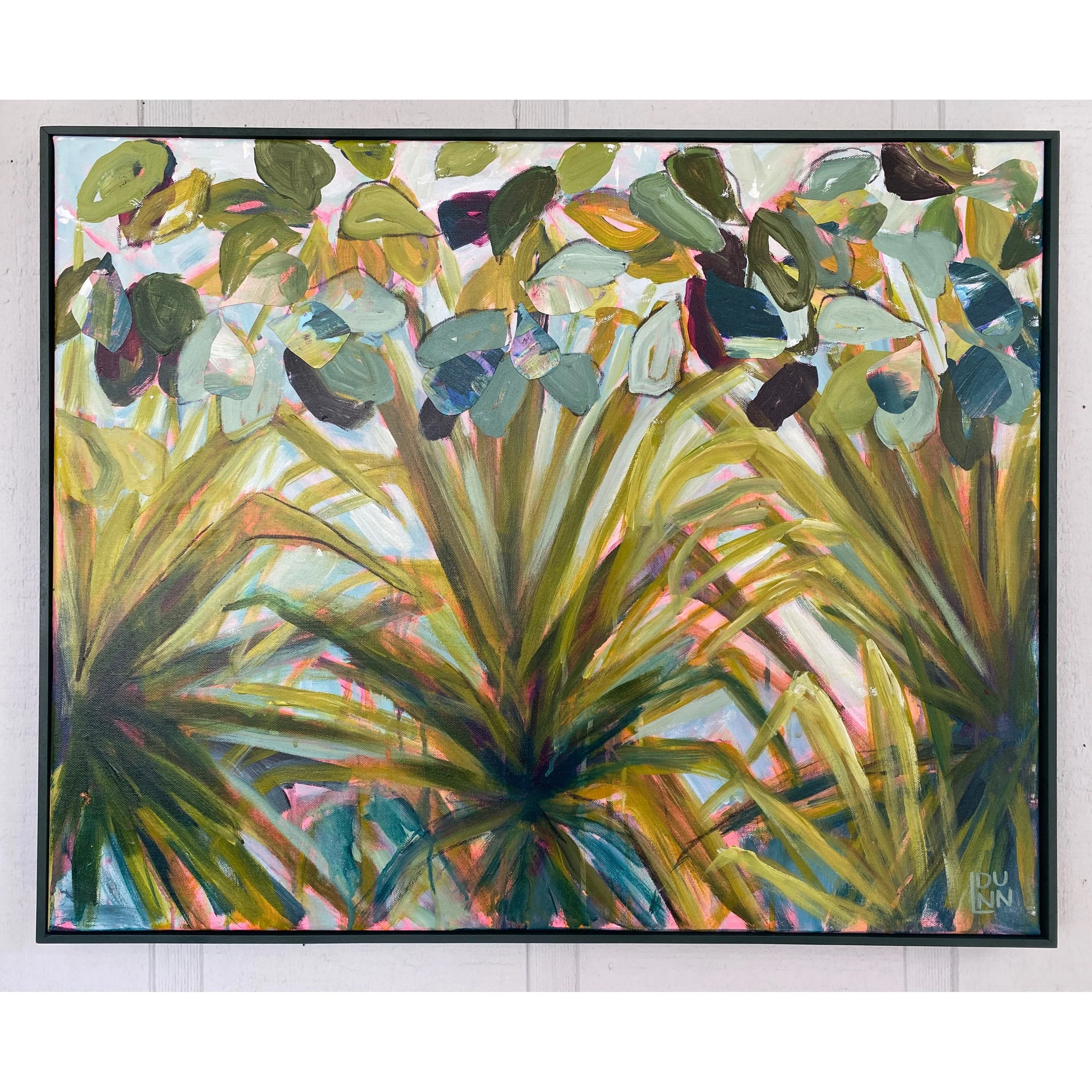 Abstract painting of green and gold leaves with colorful accents on canvas.