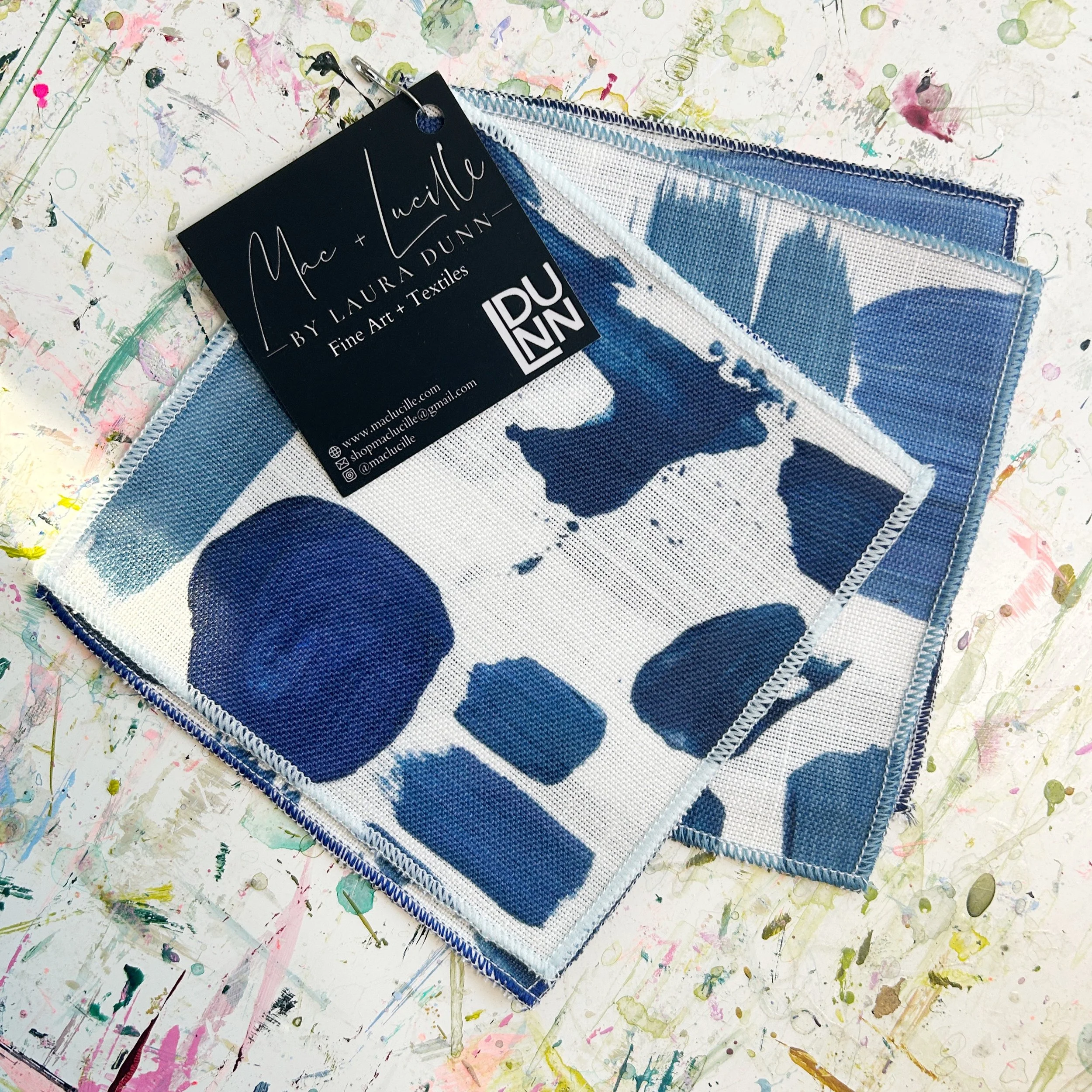 Cocktail napkins made from blue and white abstract pattern fabric designed by Laura Dunn of Mac & Lucille.