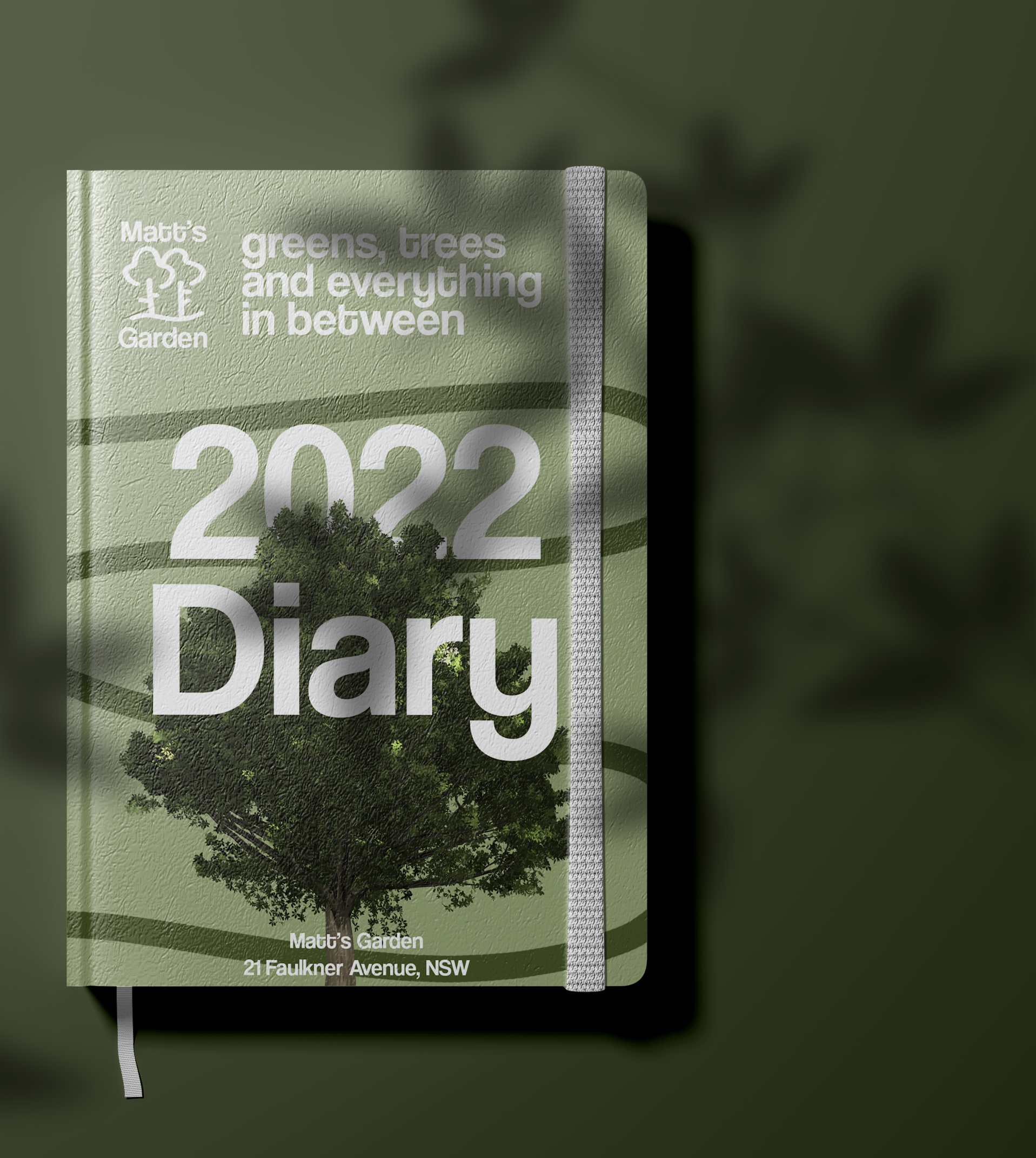 2022 diary with a green cover featuring a tree illustration, leaves, and text including 'Matt's Garden', 'greens, trees and everything in between', and an address in NSW.