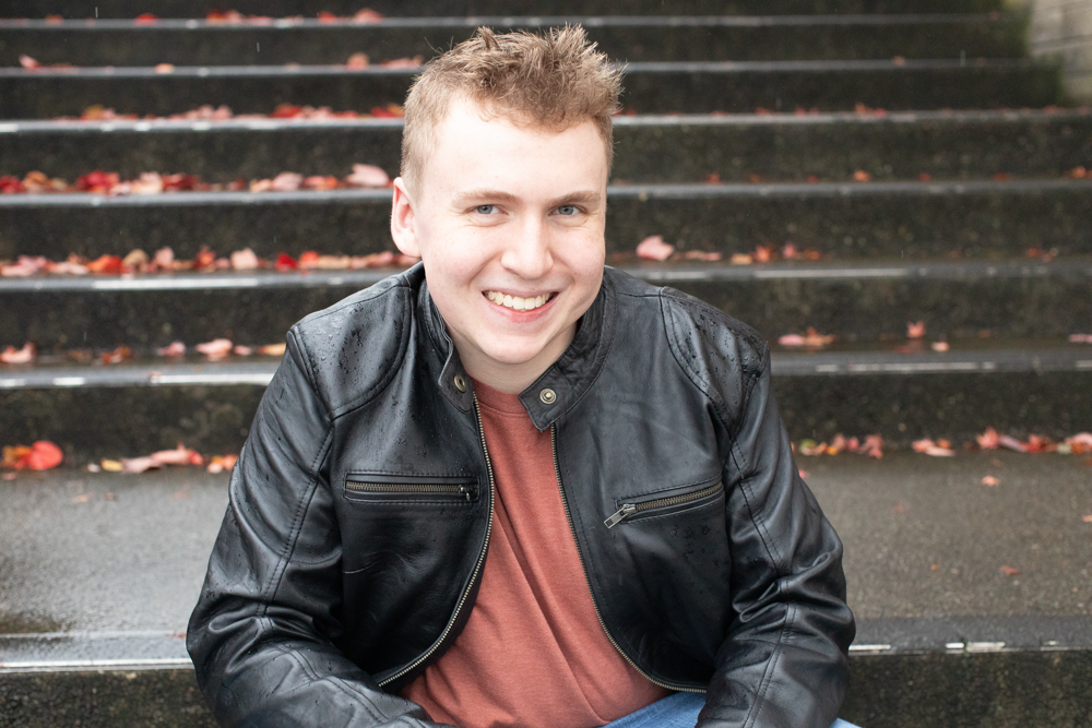 High School senior portrait of a student wearing a leather jacket