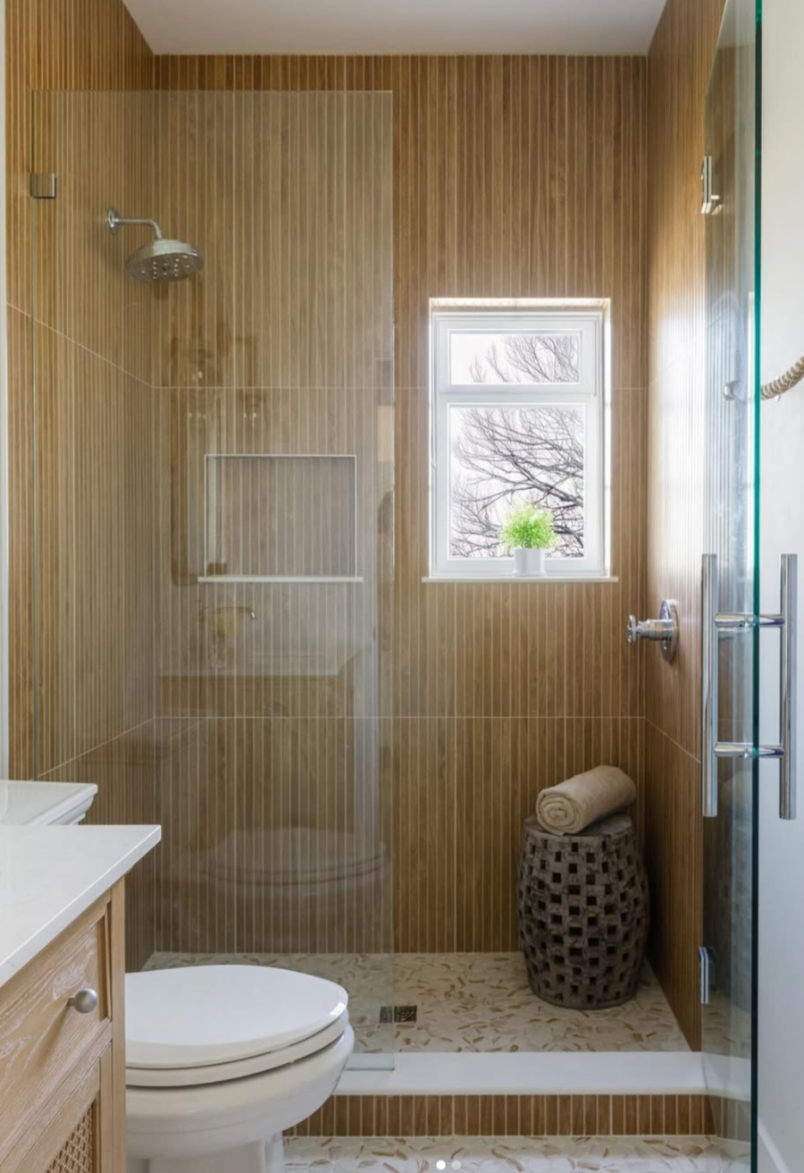 large format, wood-look Dorian Collection on the shower walls and stone-look 2" mosaic Orbesque Collection on the floor 
⁠
 Tile: Dorian Collection - Oak, Orbesque Collection - Goladin⁠
Design: @serenitydesign⁠
 @lynn_tennille_photography ⁠